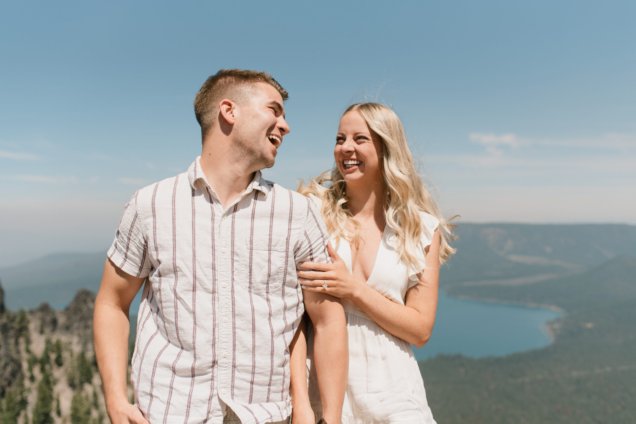 couple laughing with views in the background
