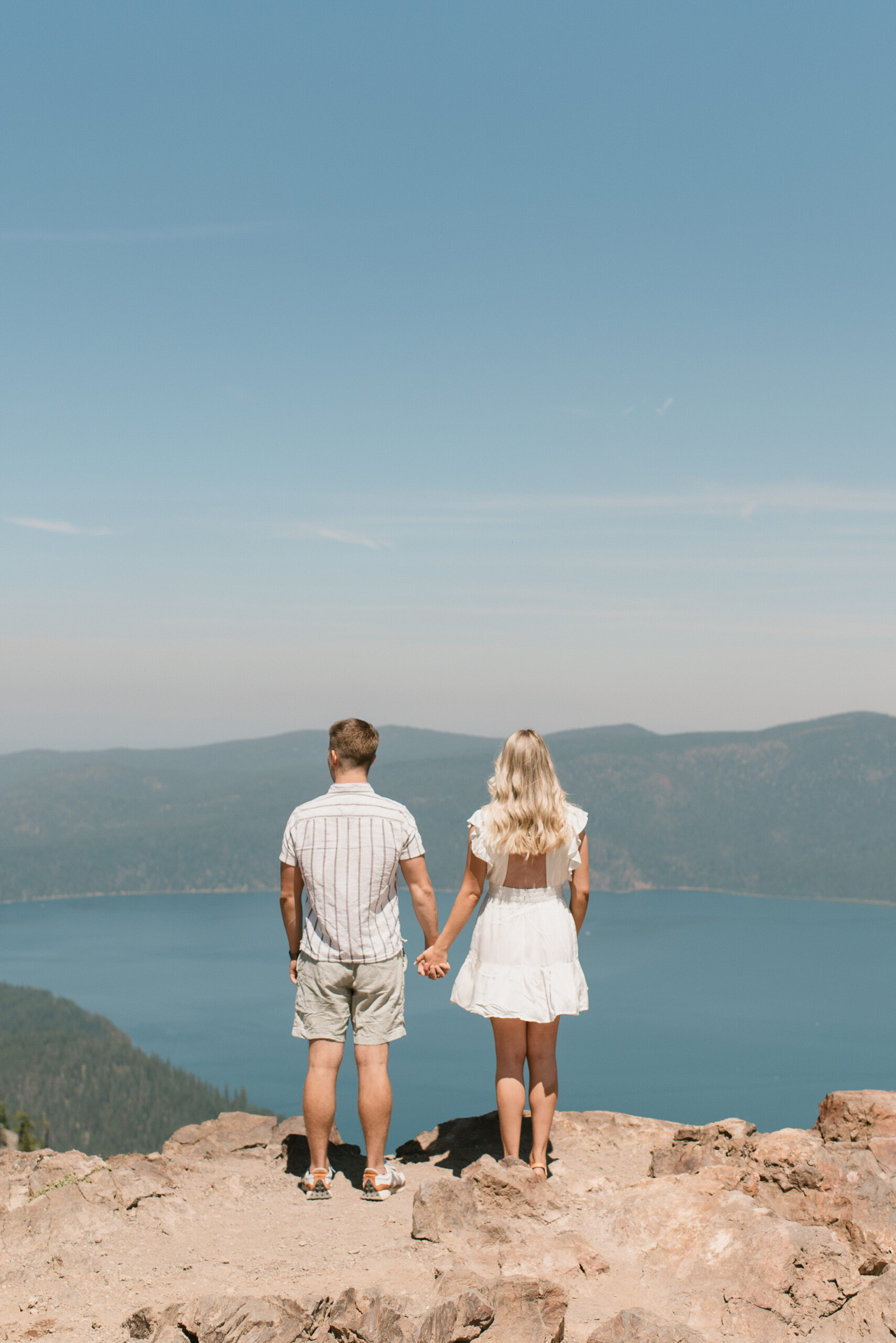 couple looking out at the view holding hands