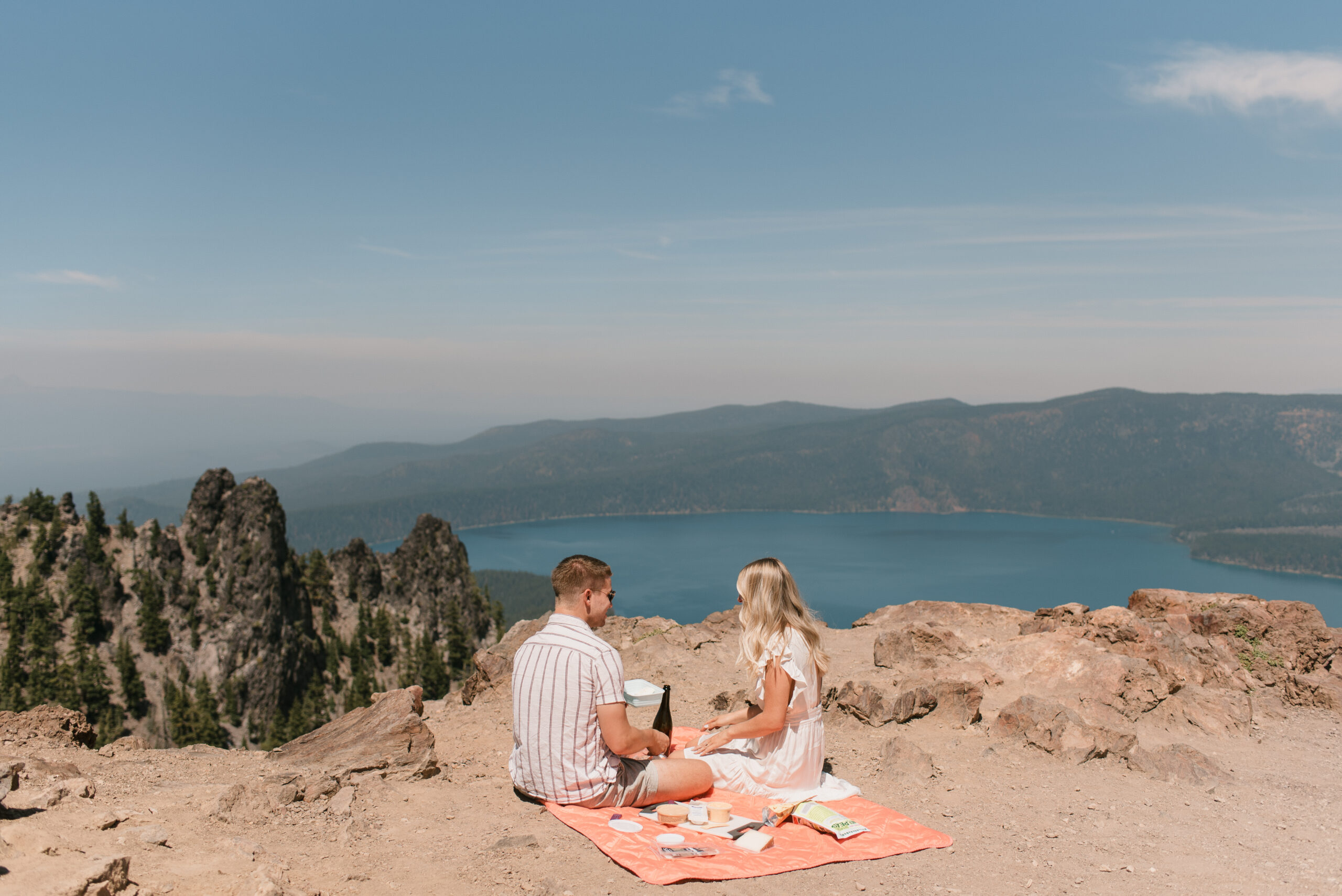 couple celebrating with a picnic after oregon proposal