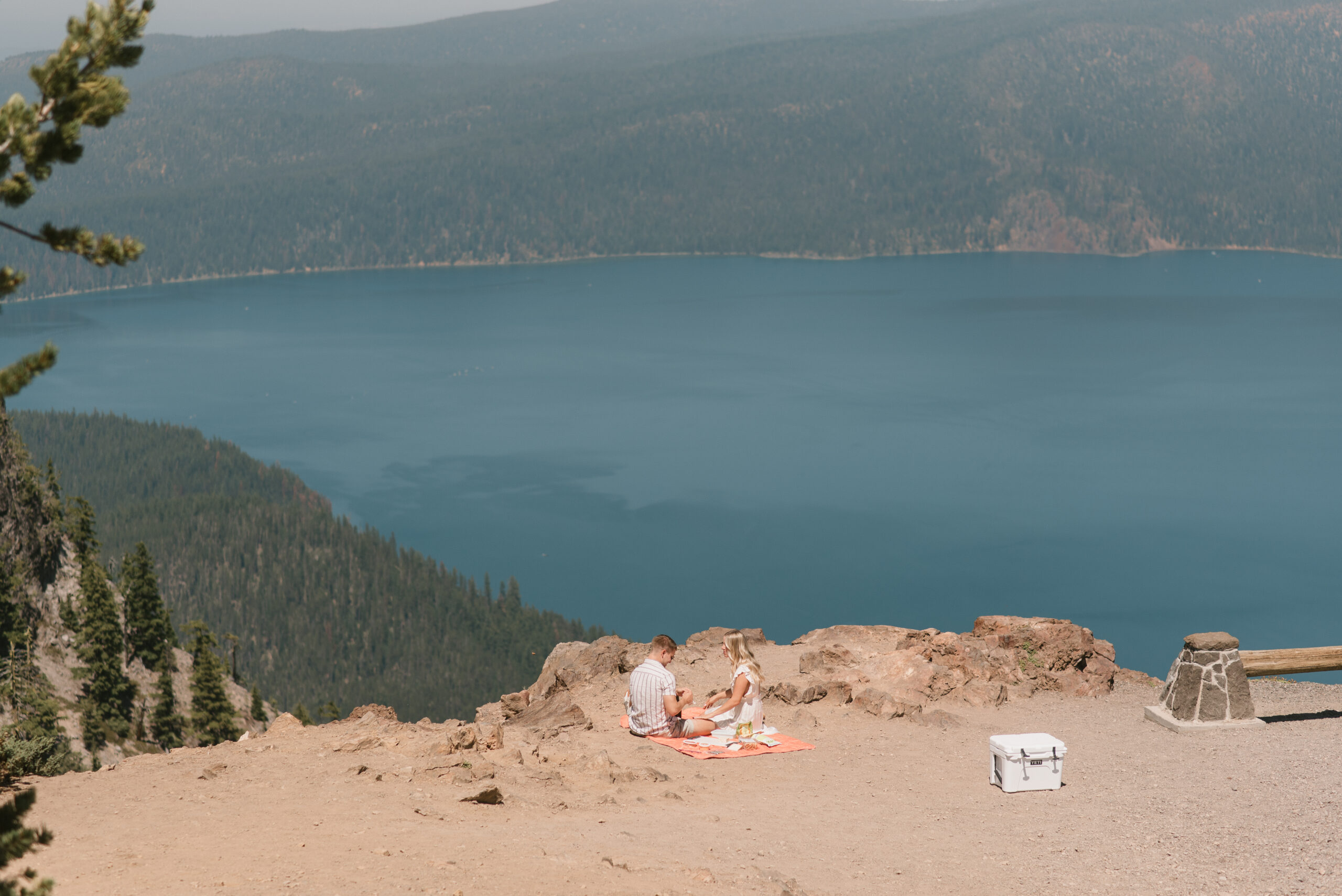 couple celebrating with a picnic after oregon proposal