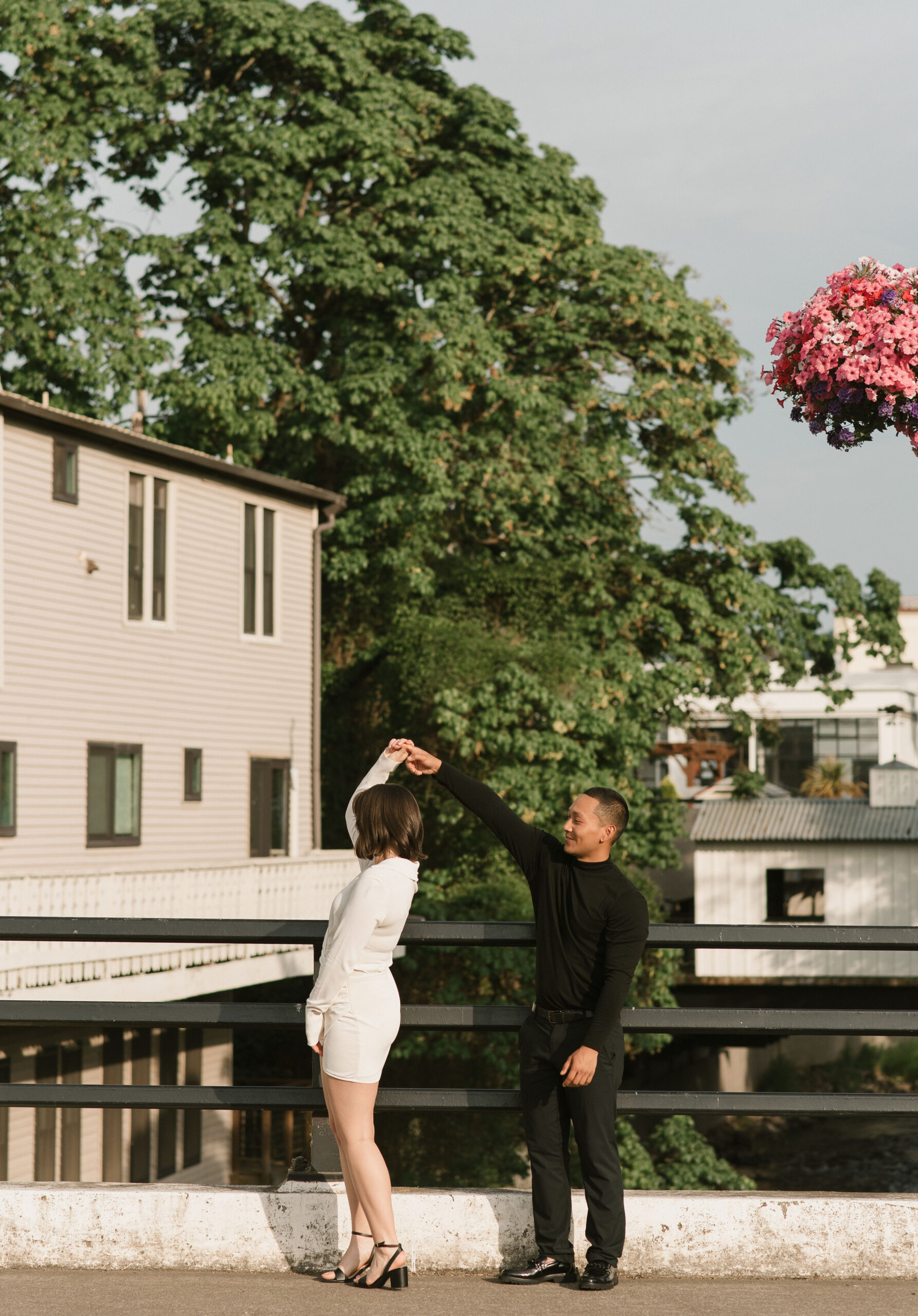 couple dancing on bridge at editorial couples photoshoot