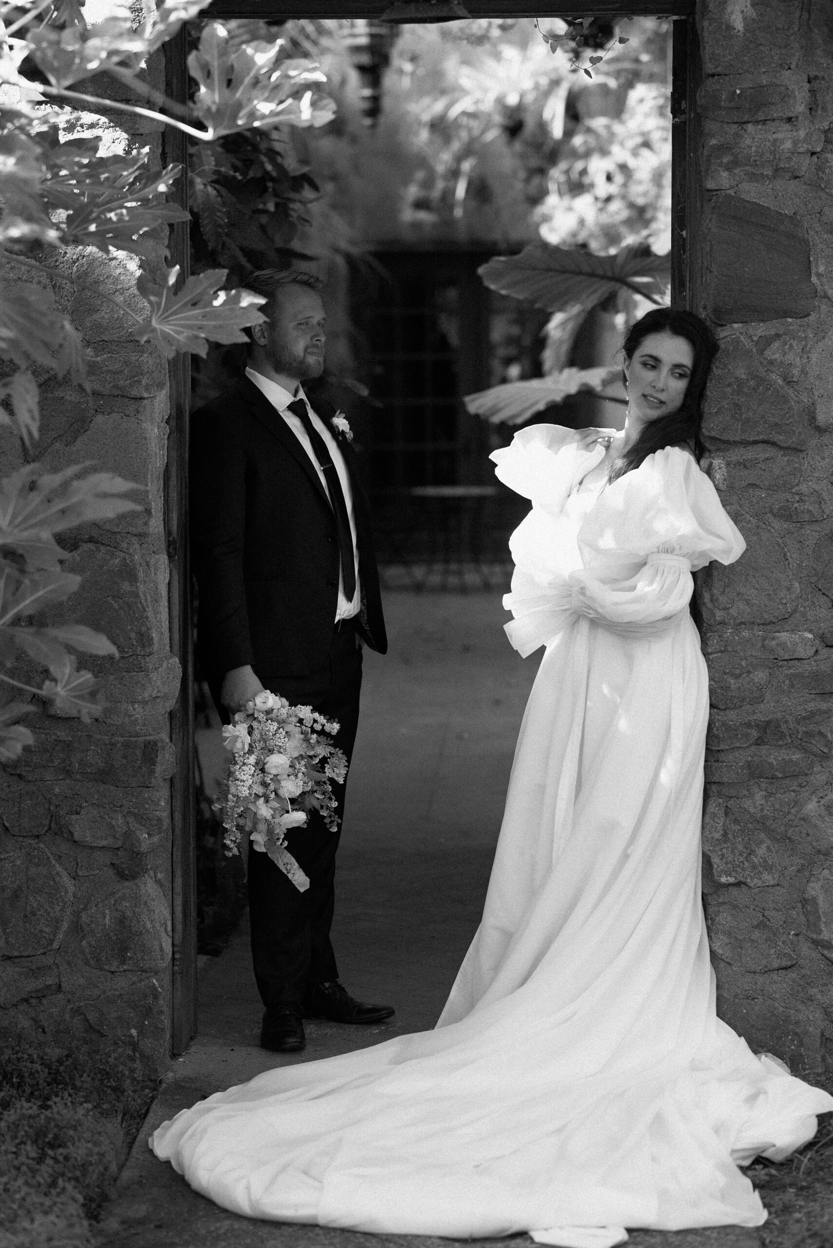 black and white bride and groom portrait from european-inspired wedding venue photos