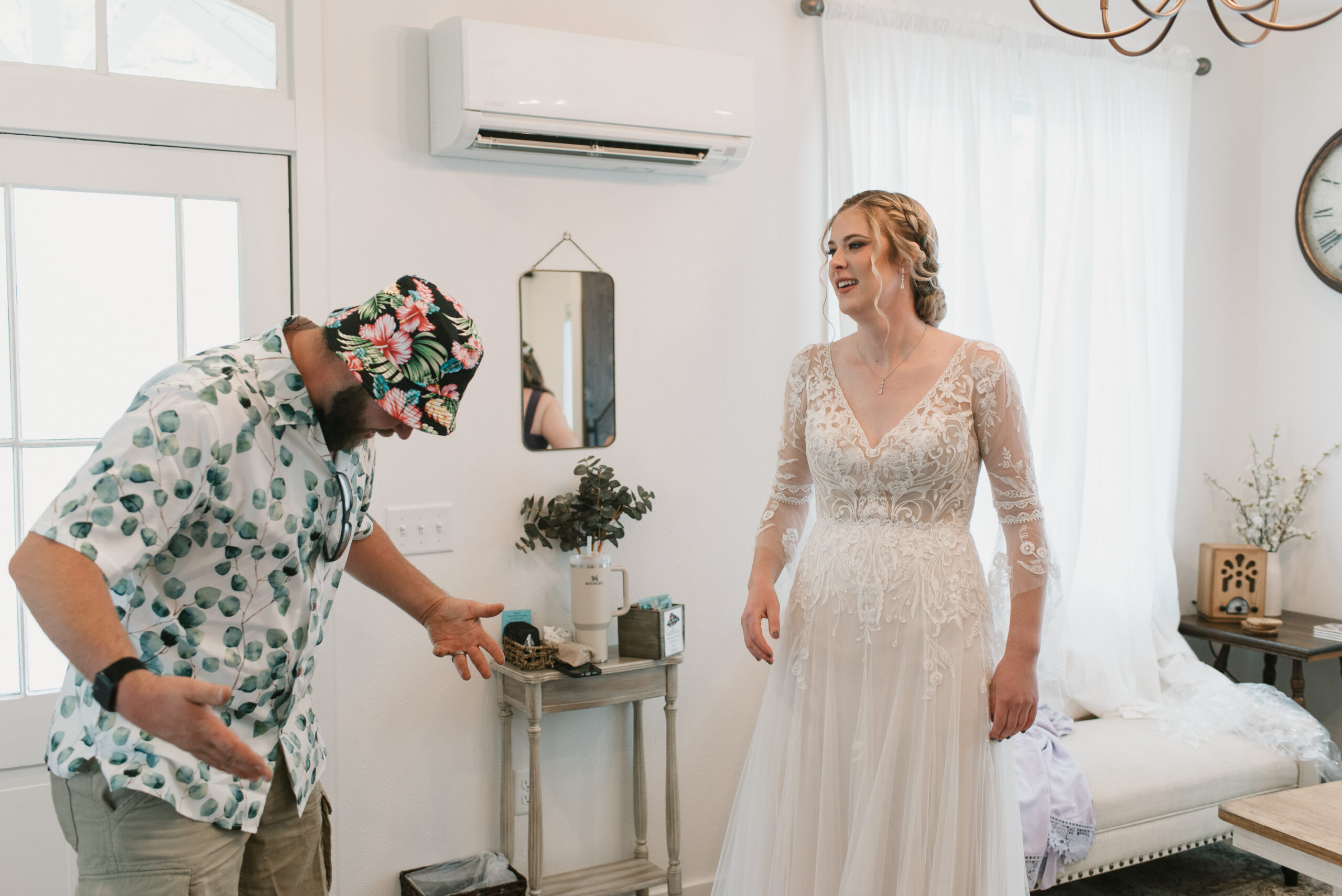 candid wedding photography of bride and brother talking