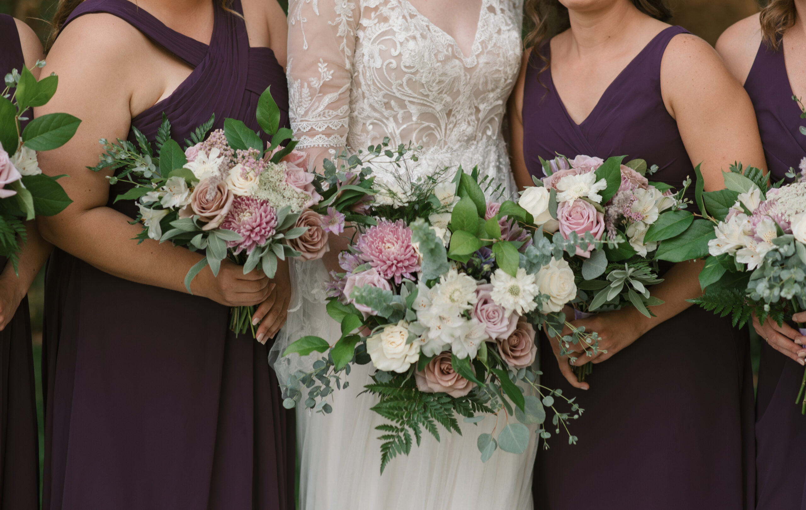 floral detail shot of bride and bridesmaids holding bouquets
