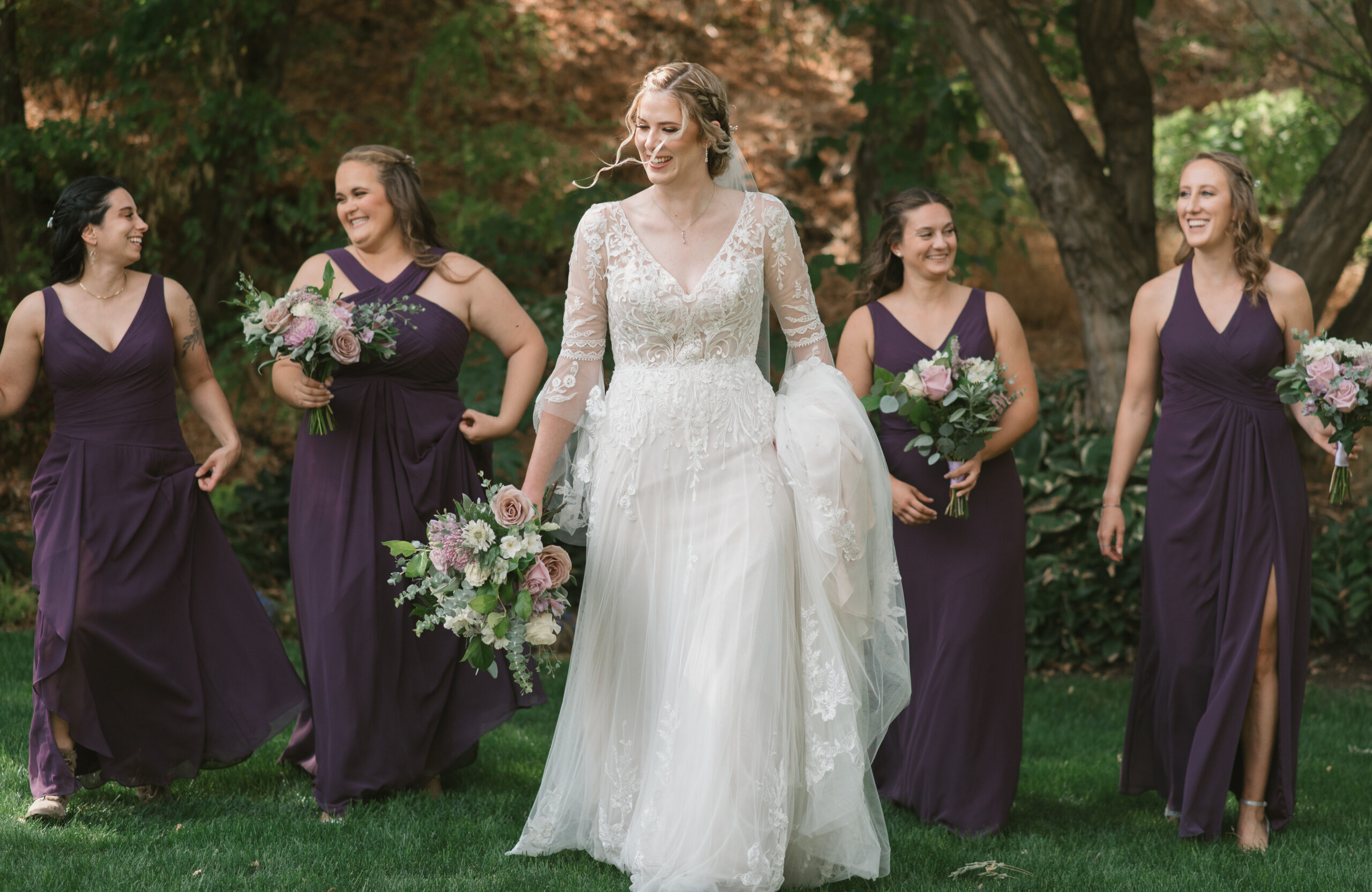 candid wedding photography of bride and bridesmaids walking and smiling