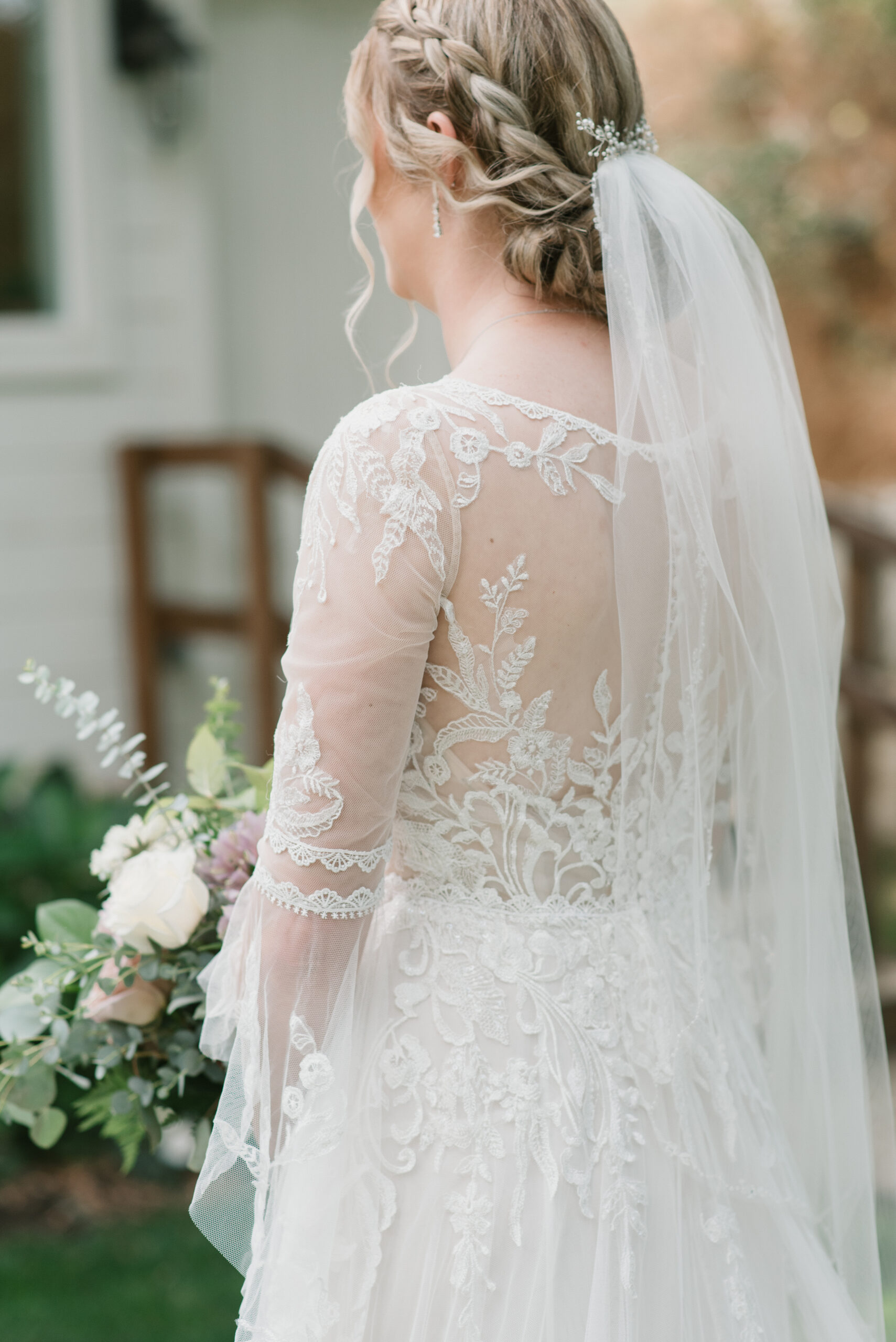 detail of brides dress and veil 