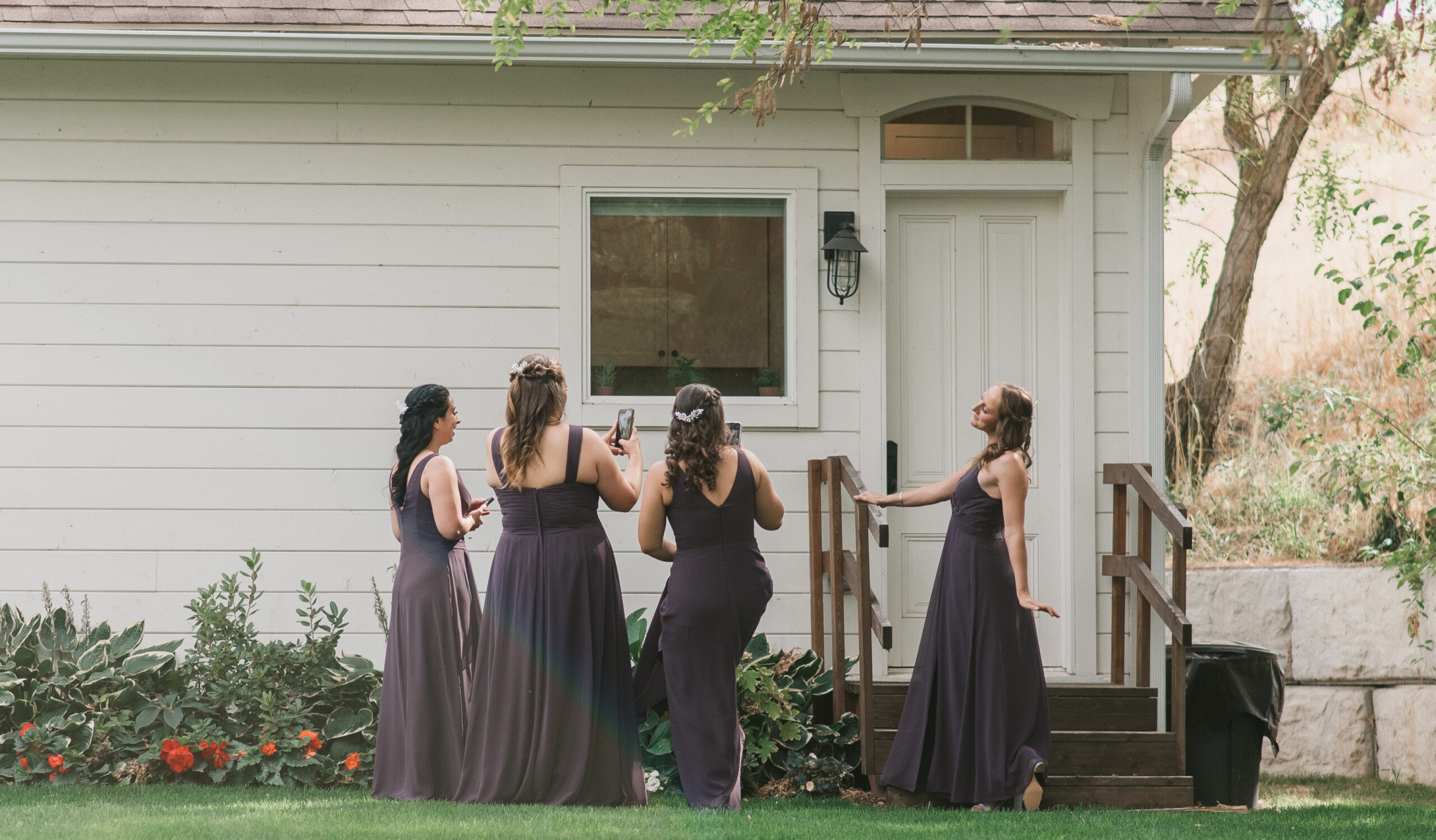 candid wedding photography of bridesmaids taking pictures