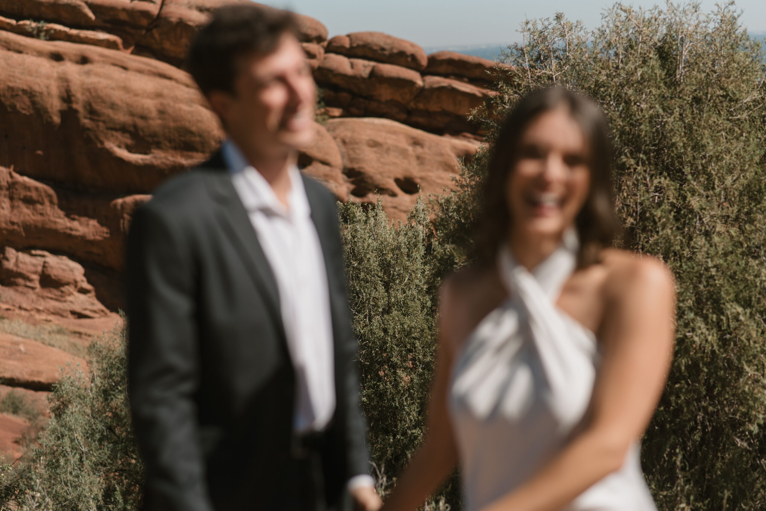 blurry bridal couple with background in focus 