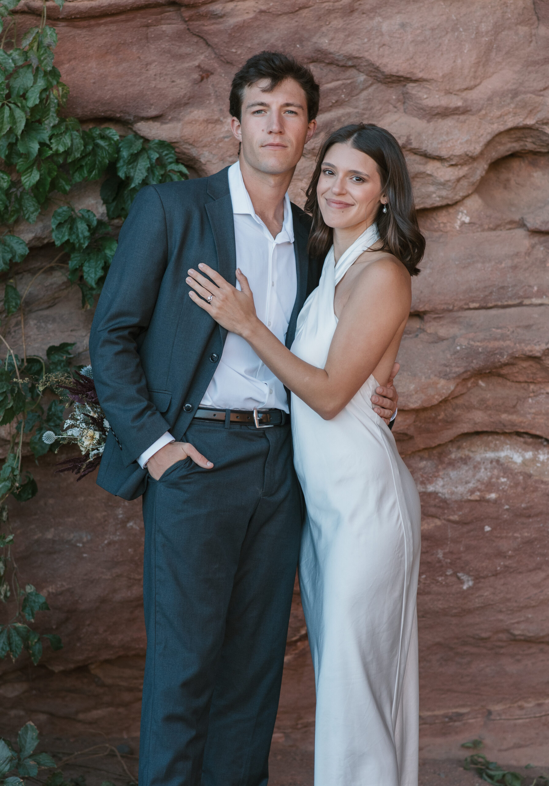 bridal couple portrait by red rocks and vines at colorado elopement 