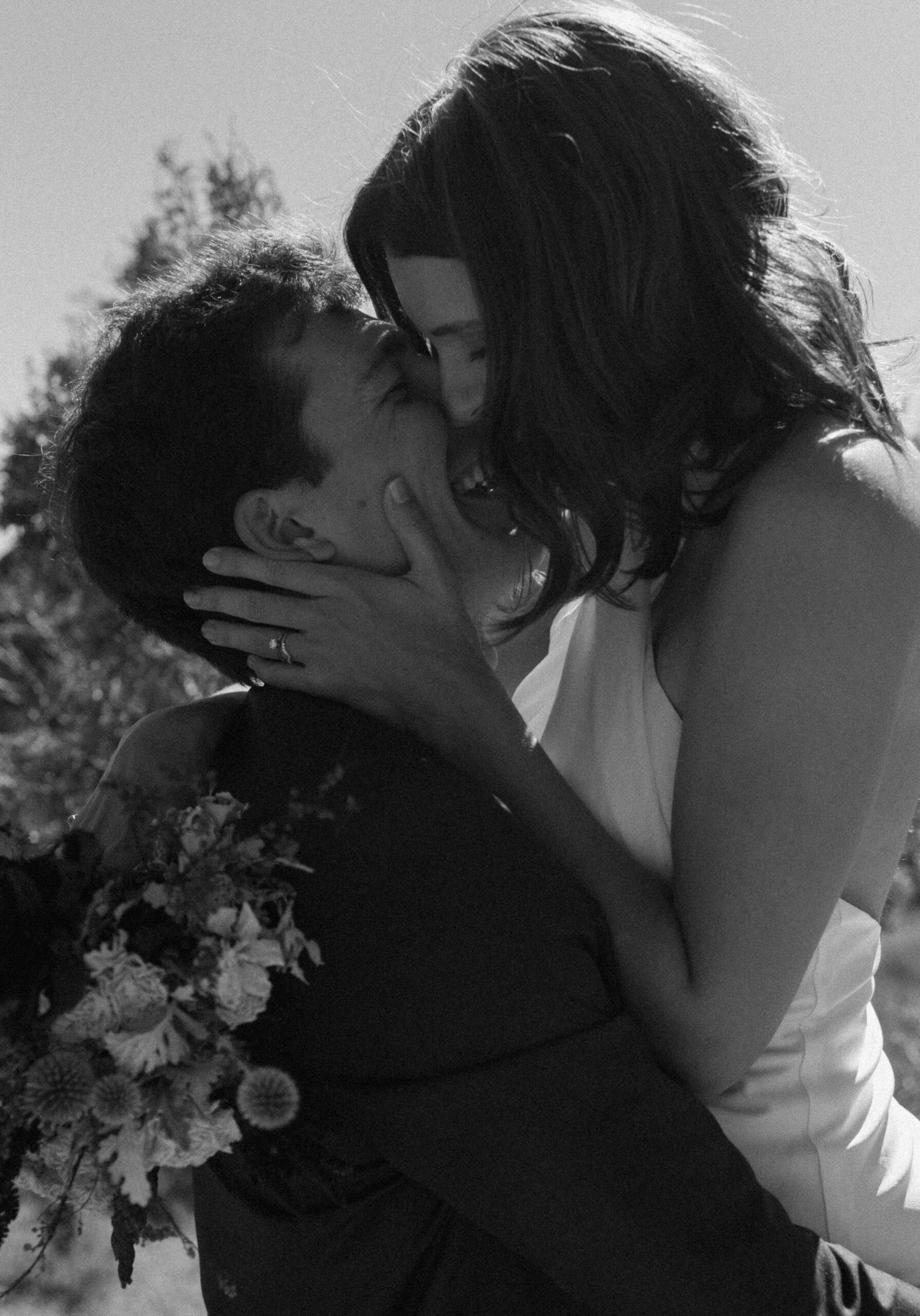 bridal couple kissing at colorado elopement 