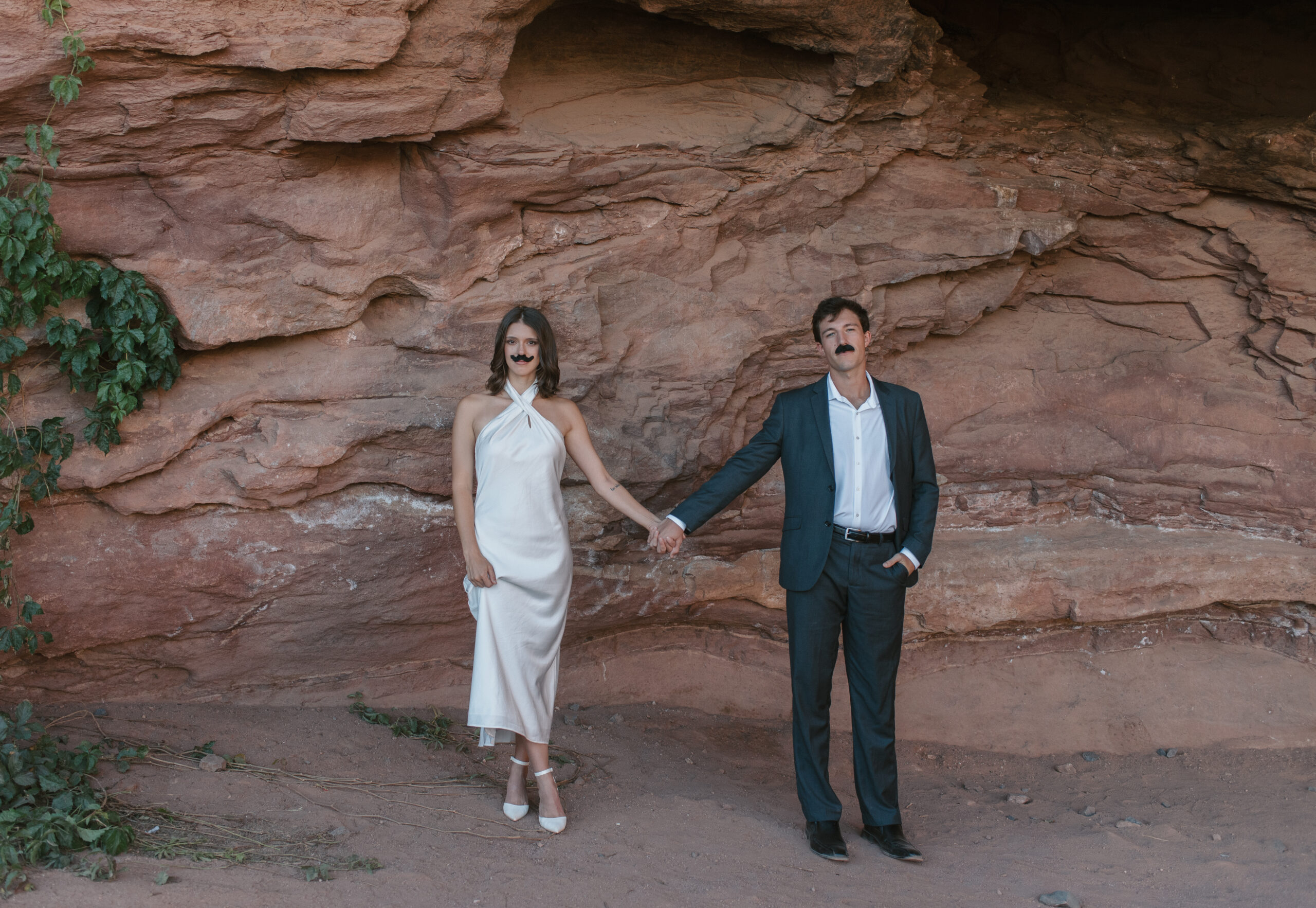 bridal couple portrait with fake mustaches on at Colorado elopement 