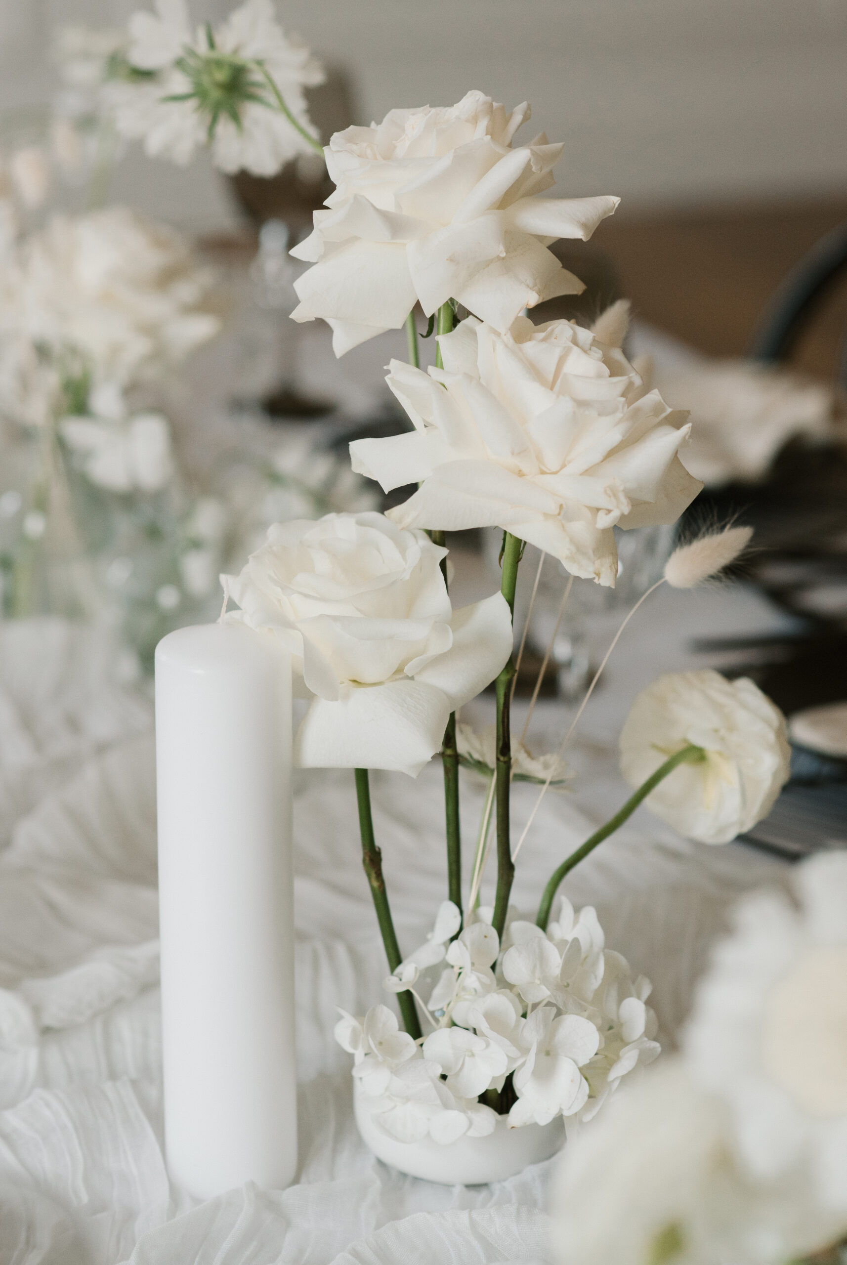 reception tablescape with white flowers and candles 