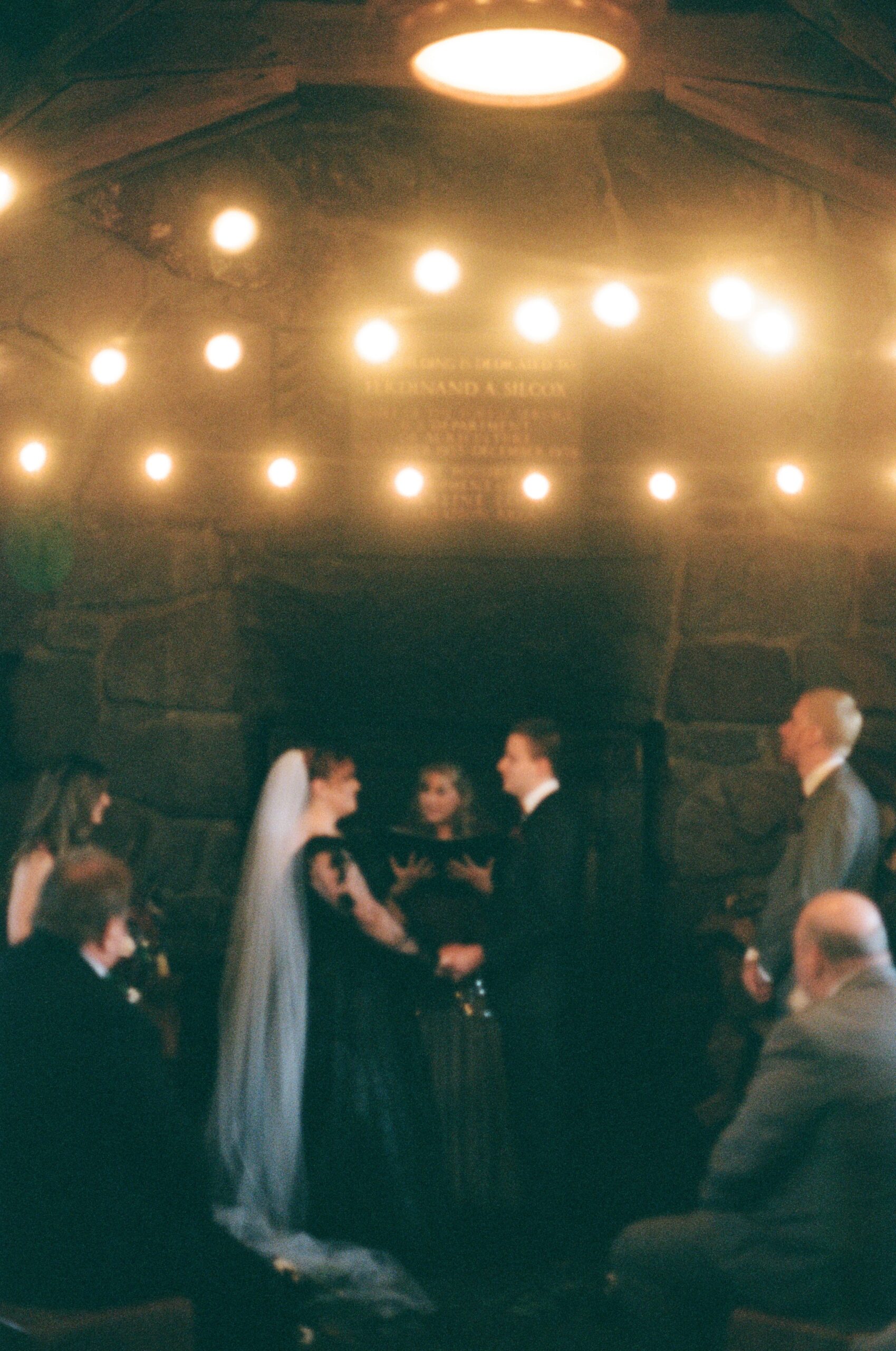 wedding film photography of couple at the altar during ceremony 
