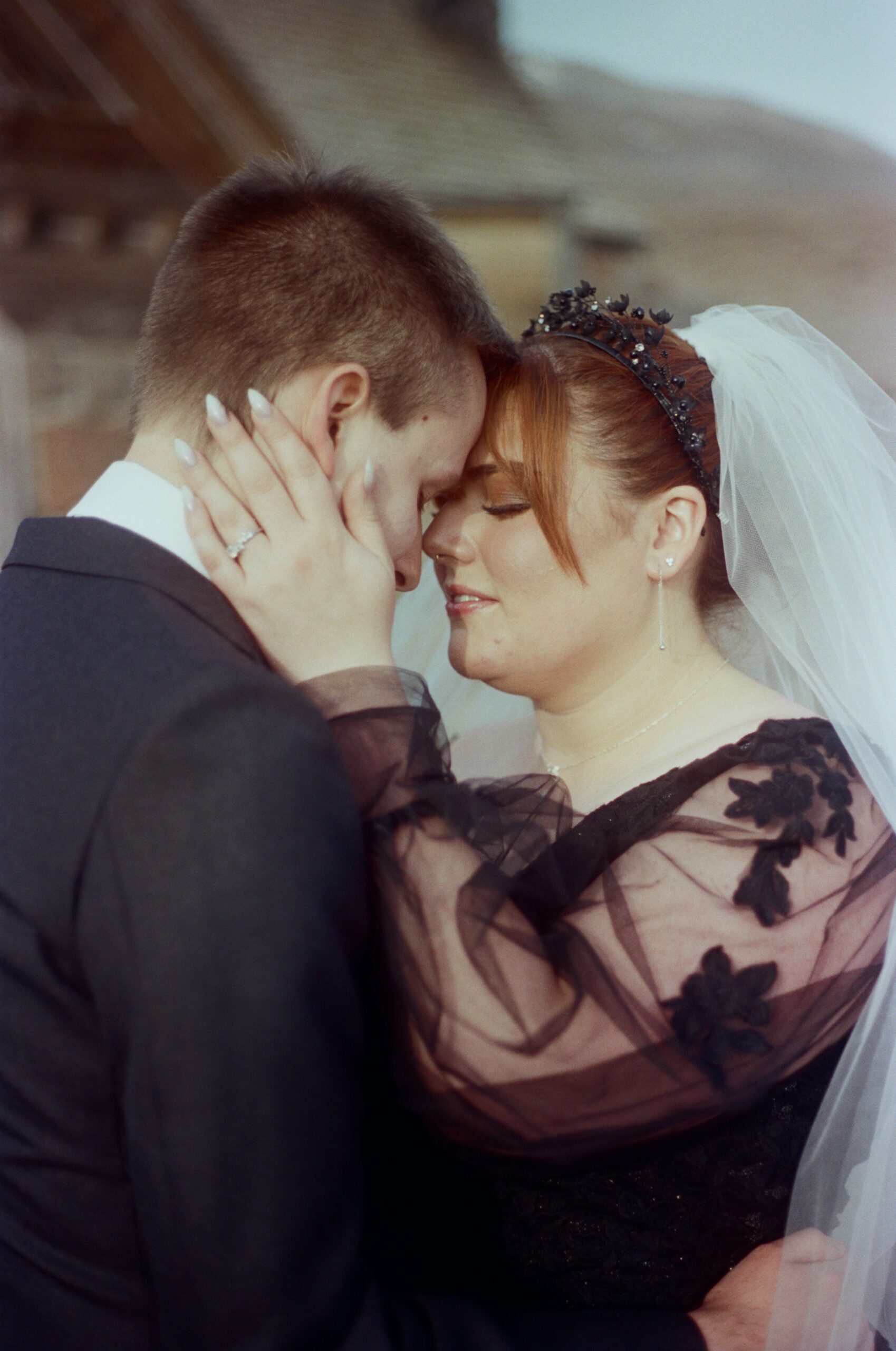 wedding couple putting their foreheads together and closing their eyes