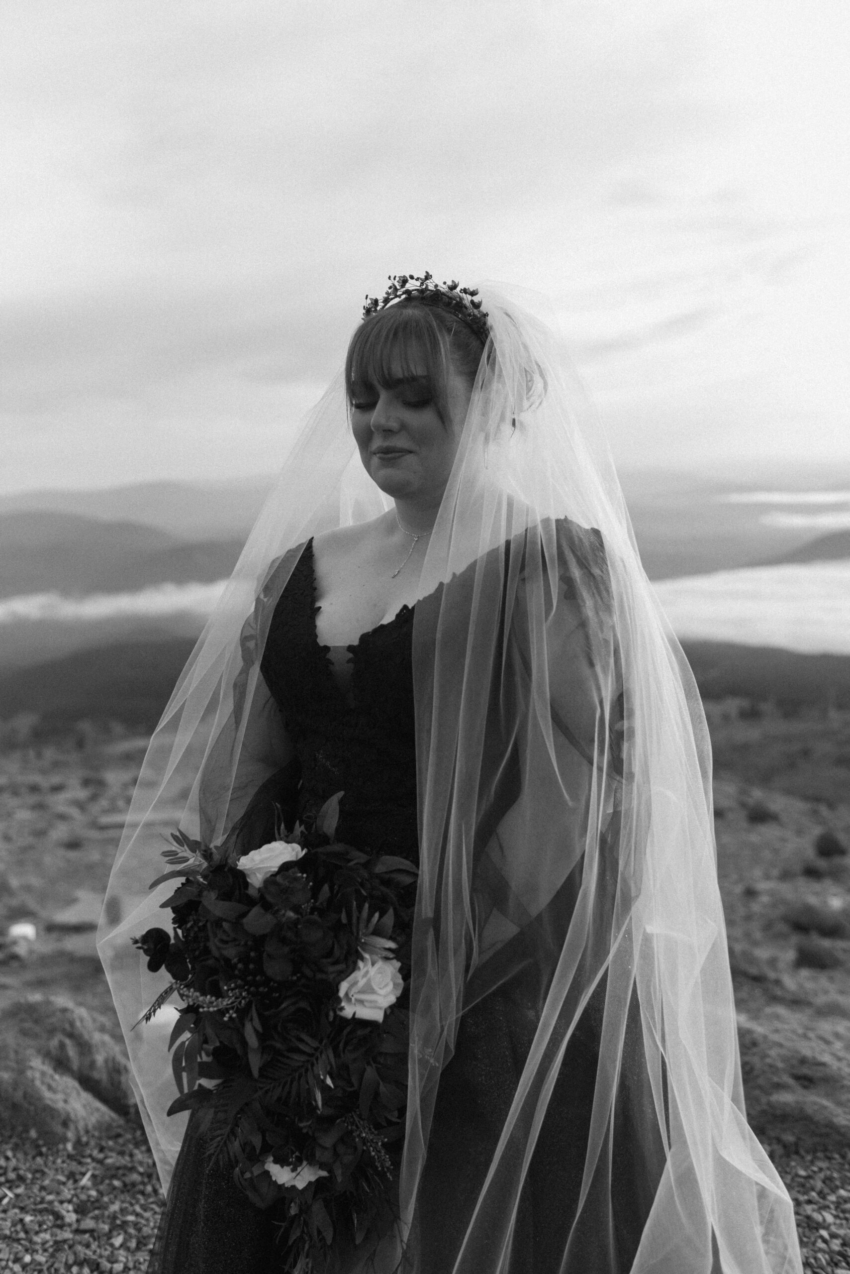 black and white bridal portrait on top of mountain 