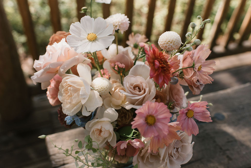 bride's bouquets with elements from the bridesmaids flowers, showing her personalized wedding details 