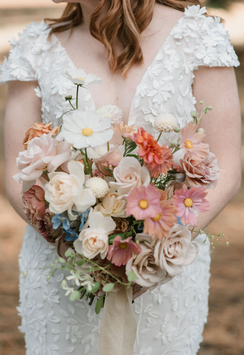a bride's colorful bouquet showing her personalized wedding detail choices! 