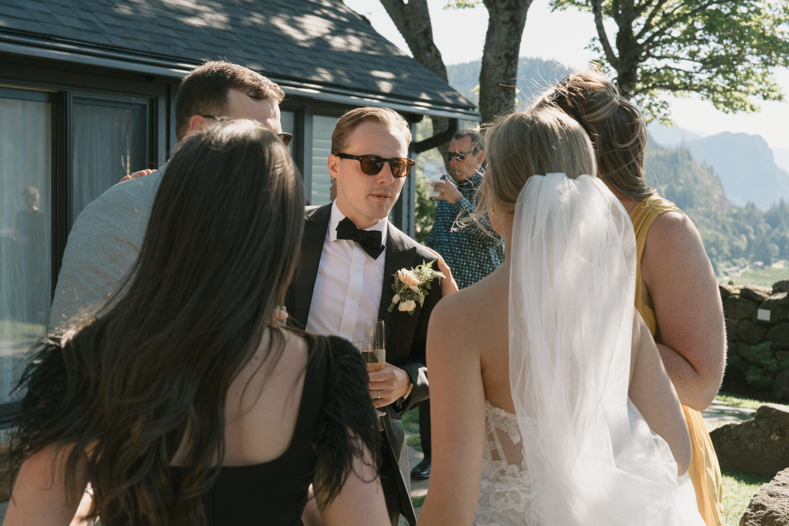 bride and groom mingling with their guests during cocktail hour at the griffin house