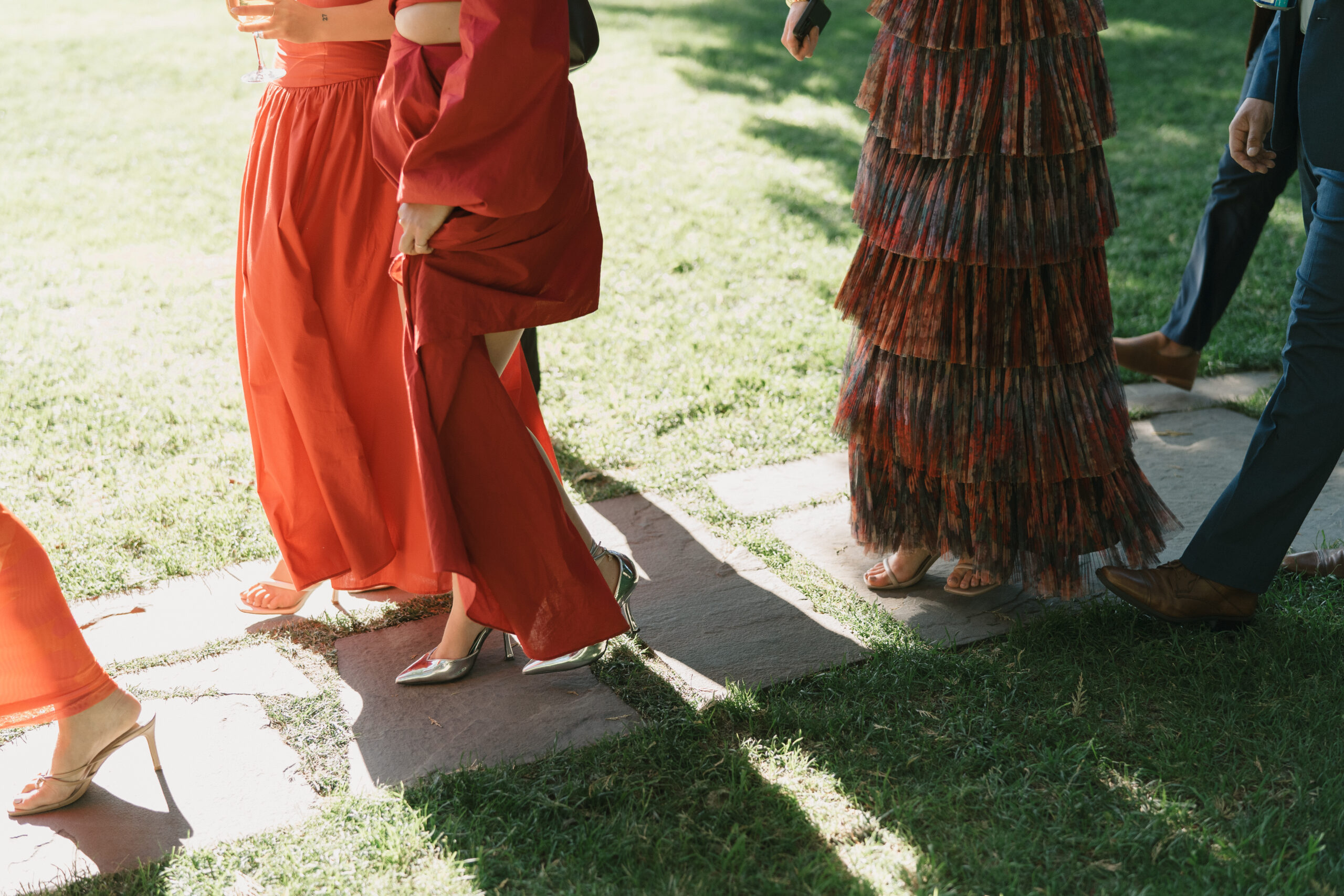 fashion of the guests heading to the reception tent