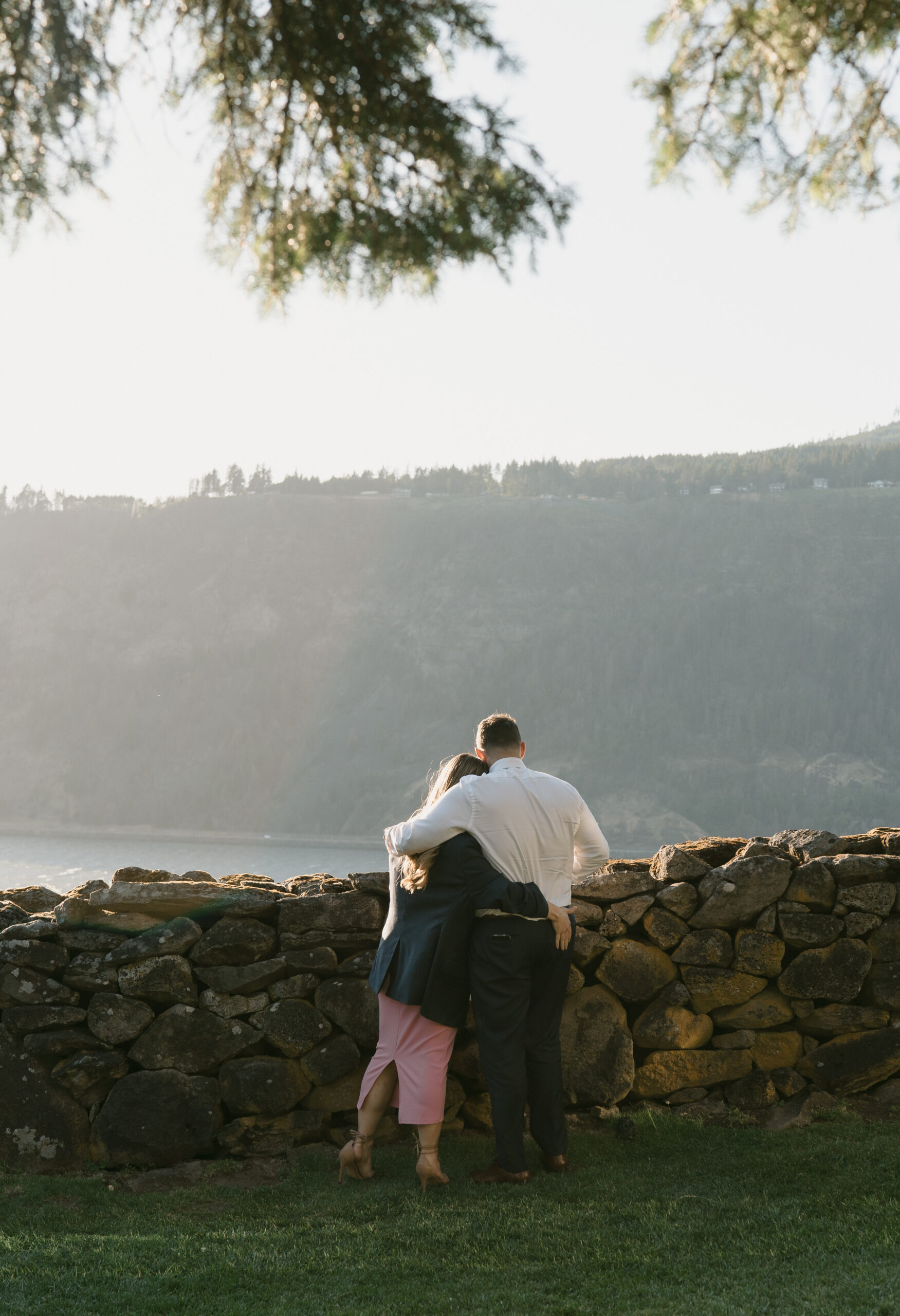 a couple overlooking the Columbia river gorge at the griffin house