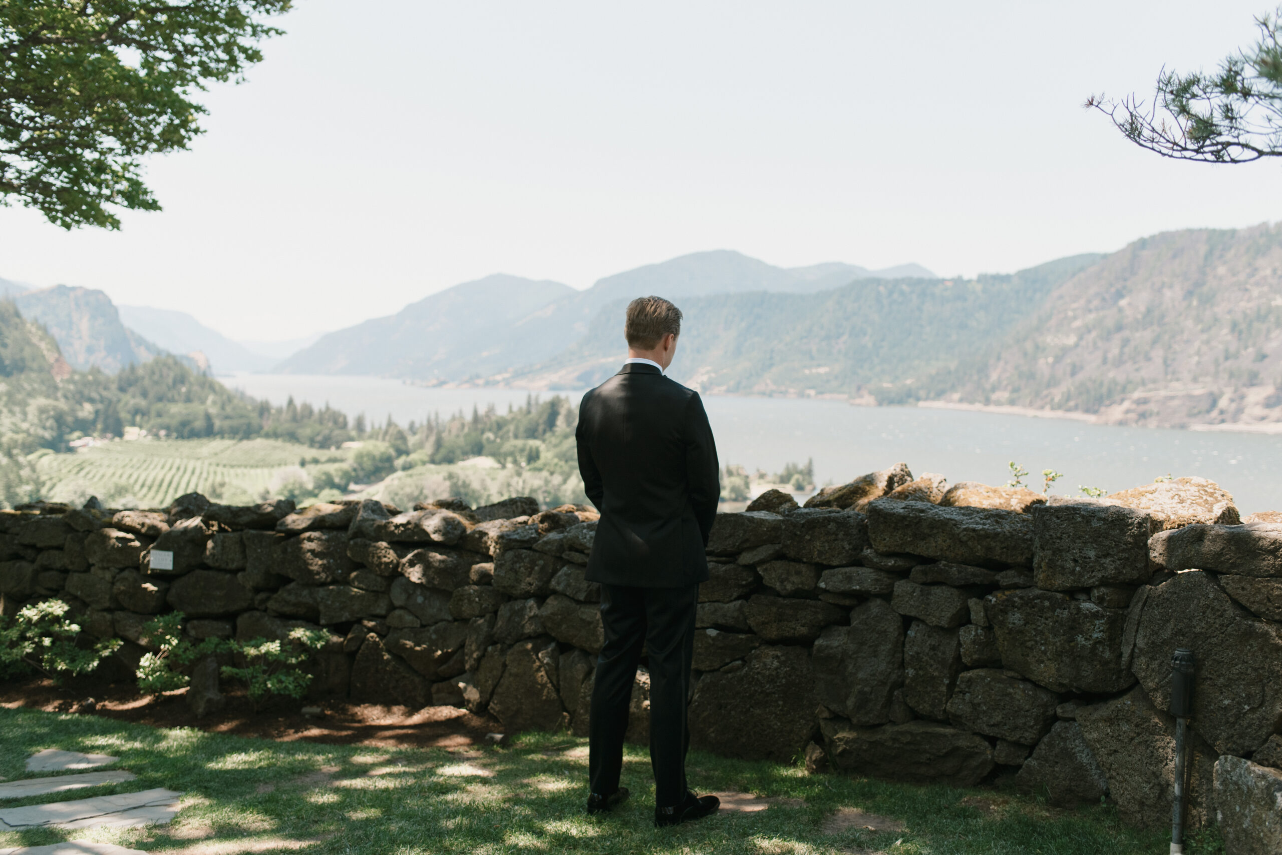 Groom waiting patiently outside of the Griffin House for his first look with his bride