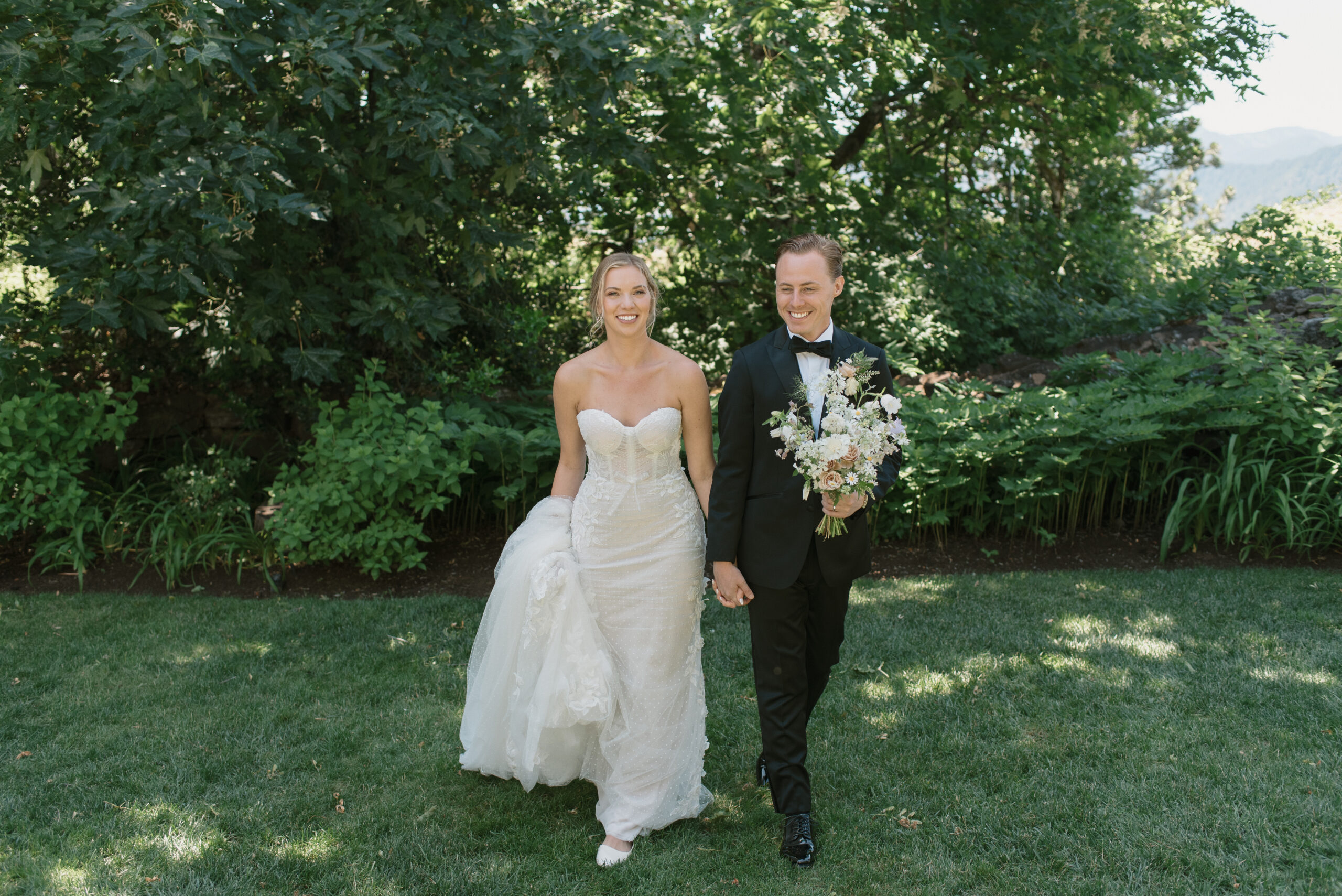 The bride and groom walking and laughing together