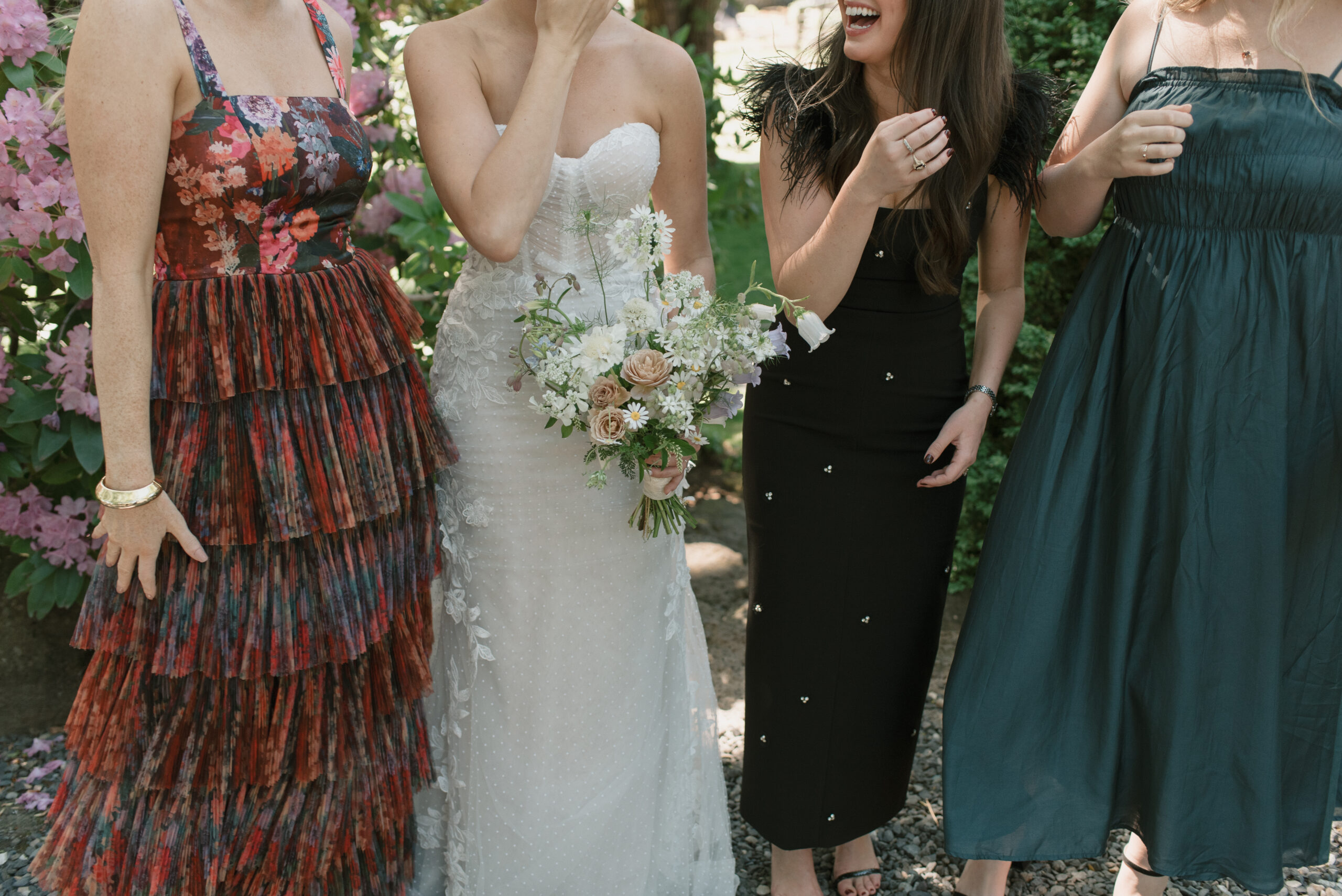 A close up photo of the bride and her fashion forward friends' outfits