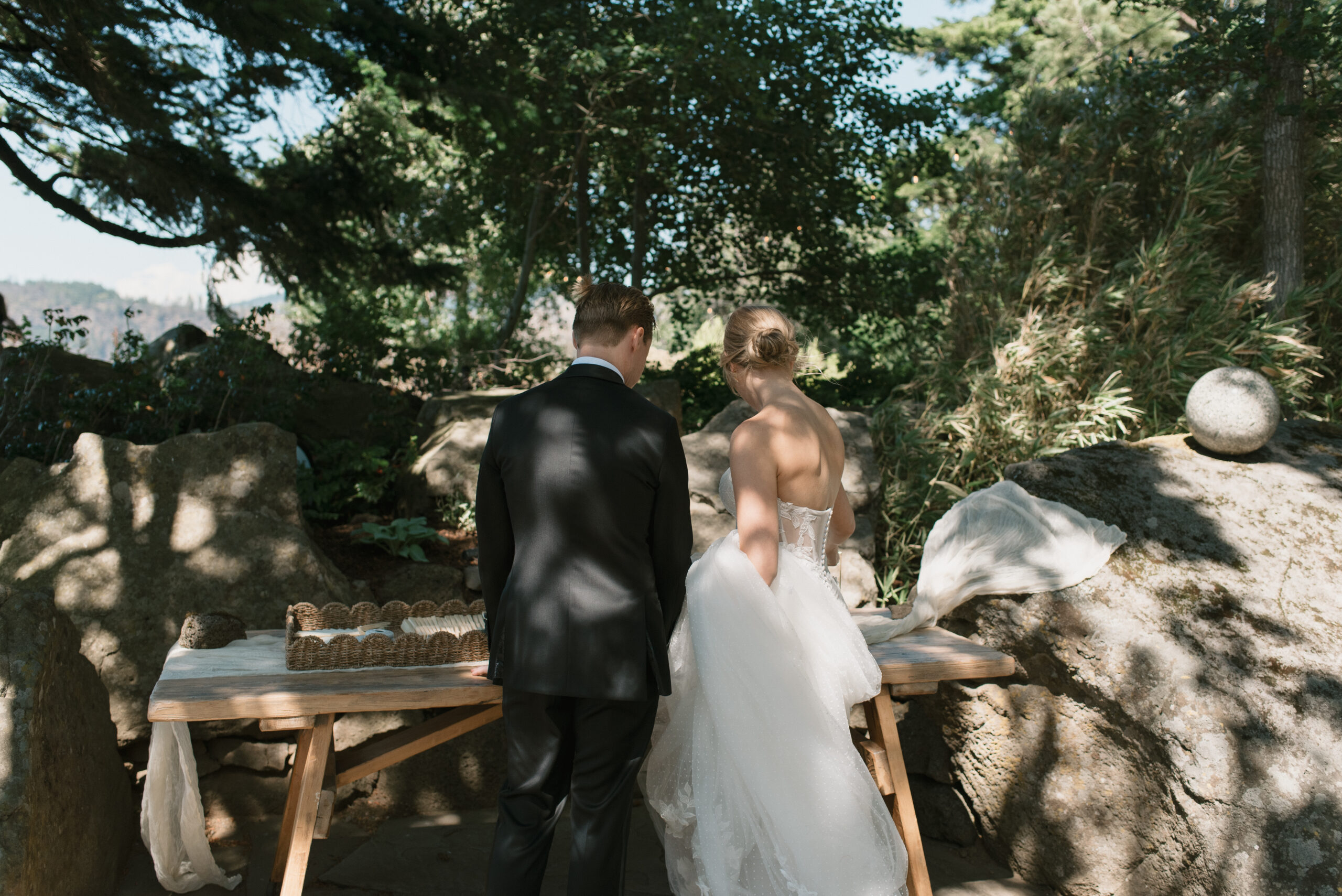 Bride and groom admiring their welcome table at The Griffin House