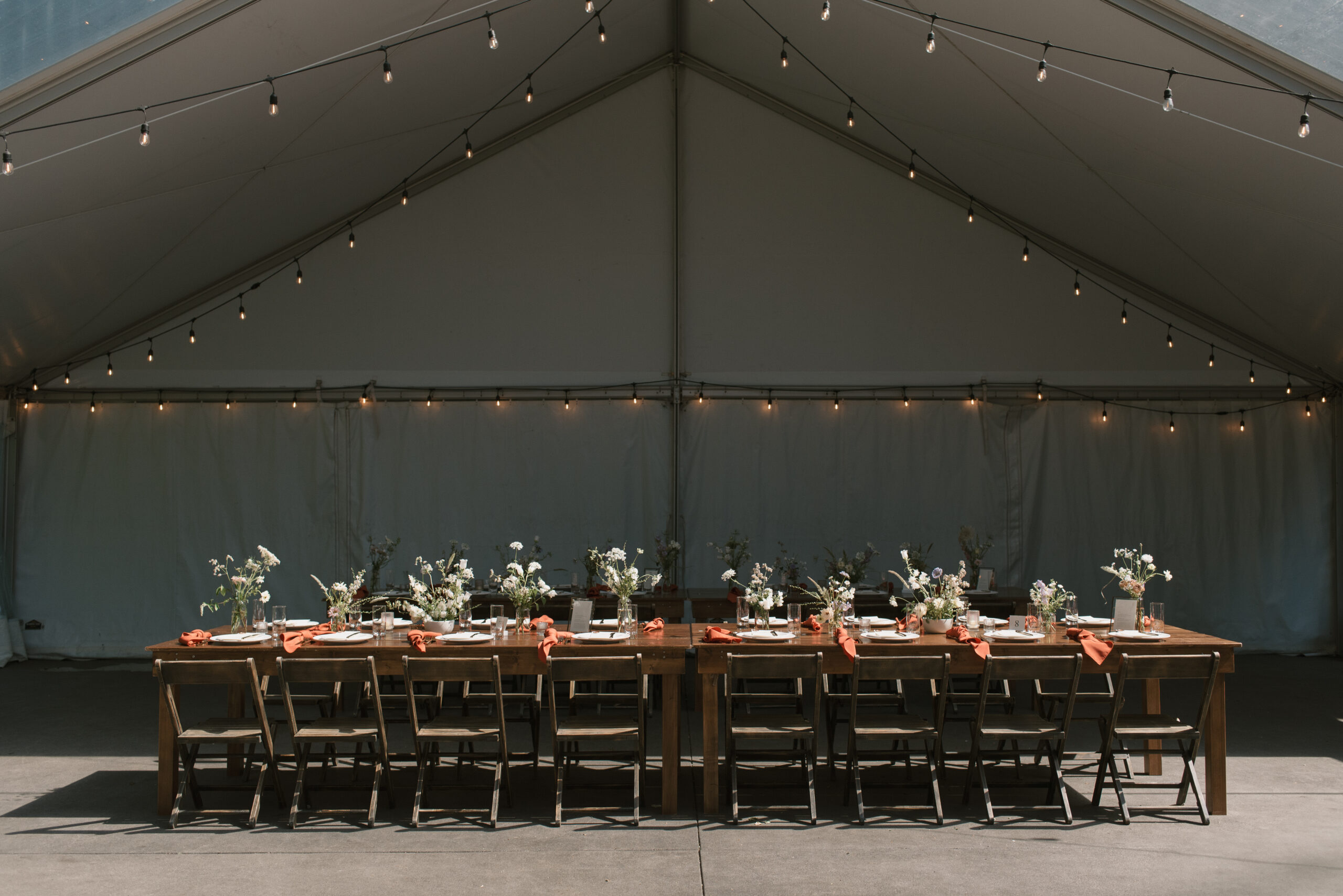 an asymmetrical shot of the wedding reception tent at the griffin house