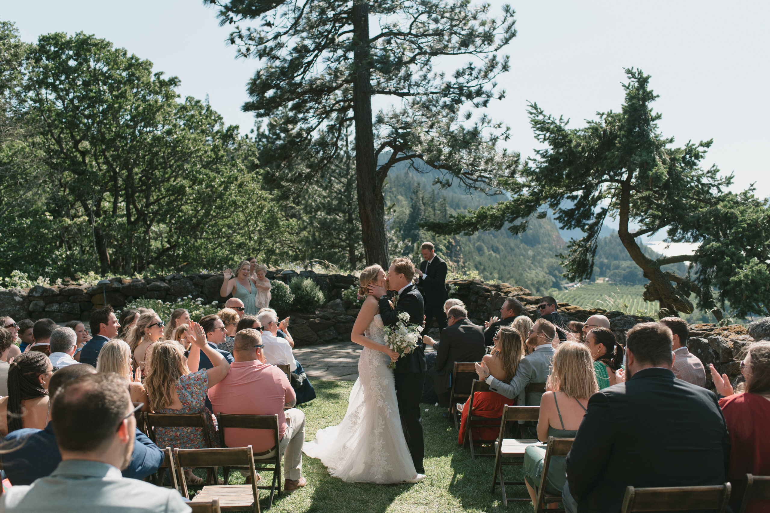 the couple kiss as they walk back down the isle married