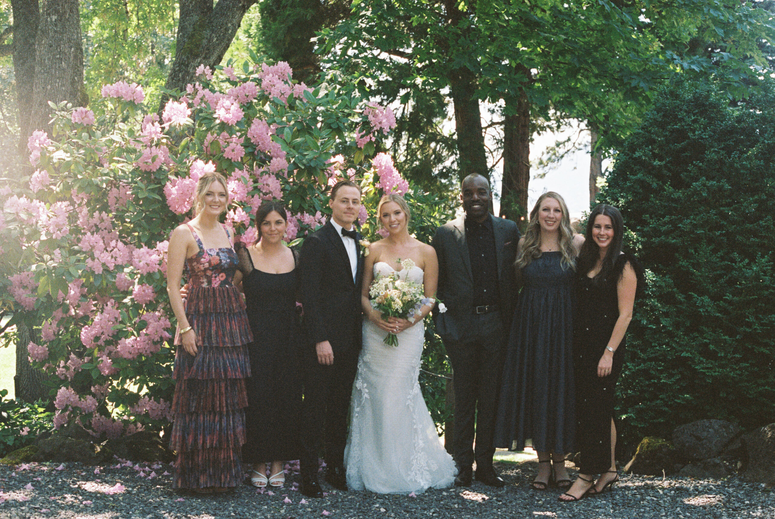 A film photo of the bride and groom with their closest friends