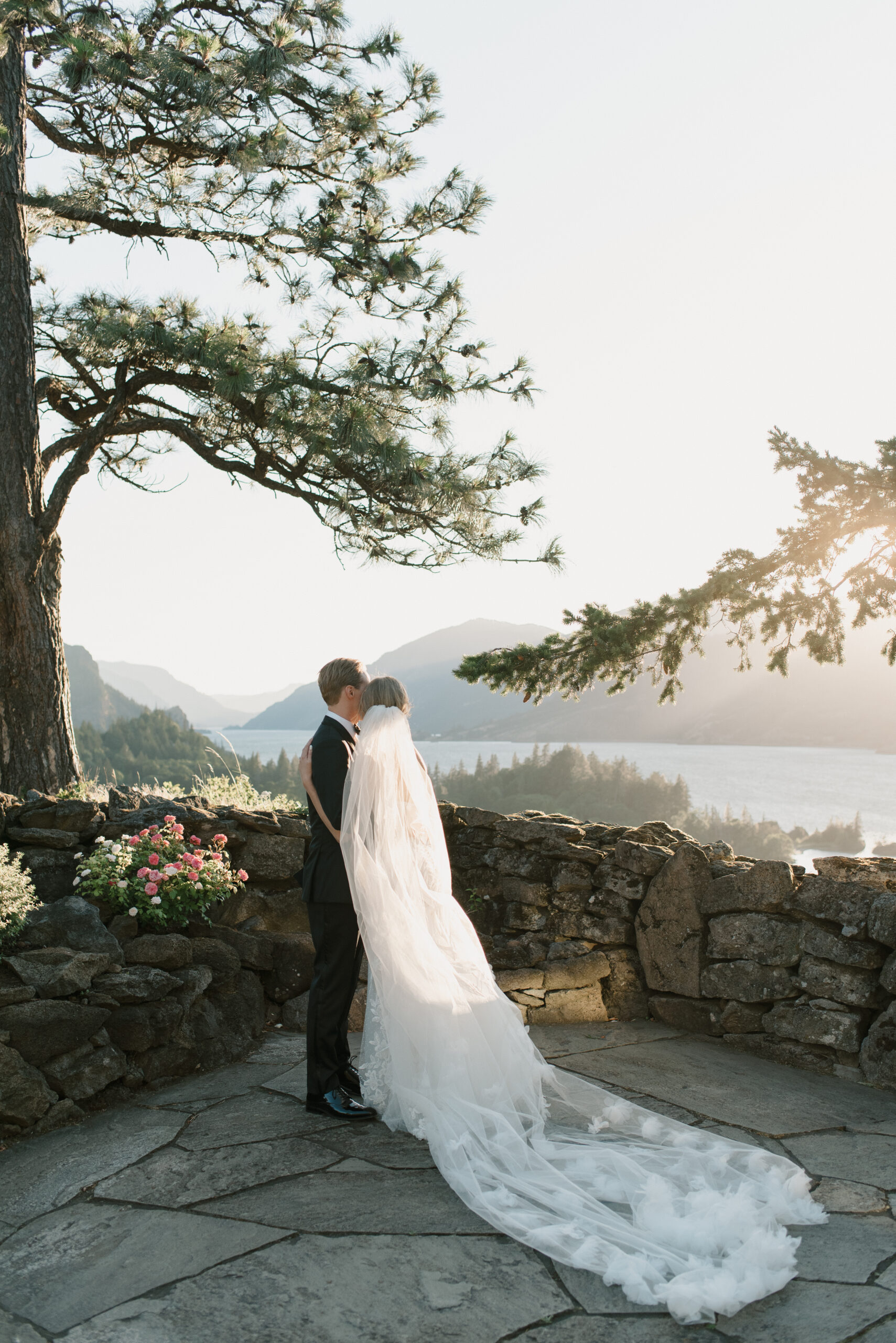 the bride and groom embracing 