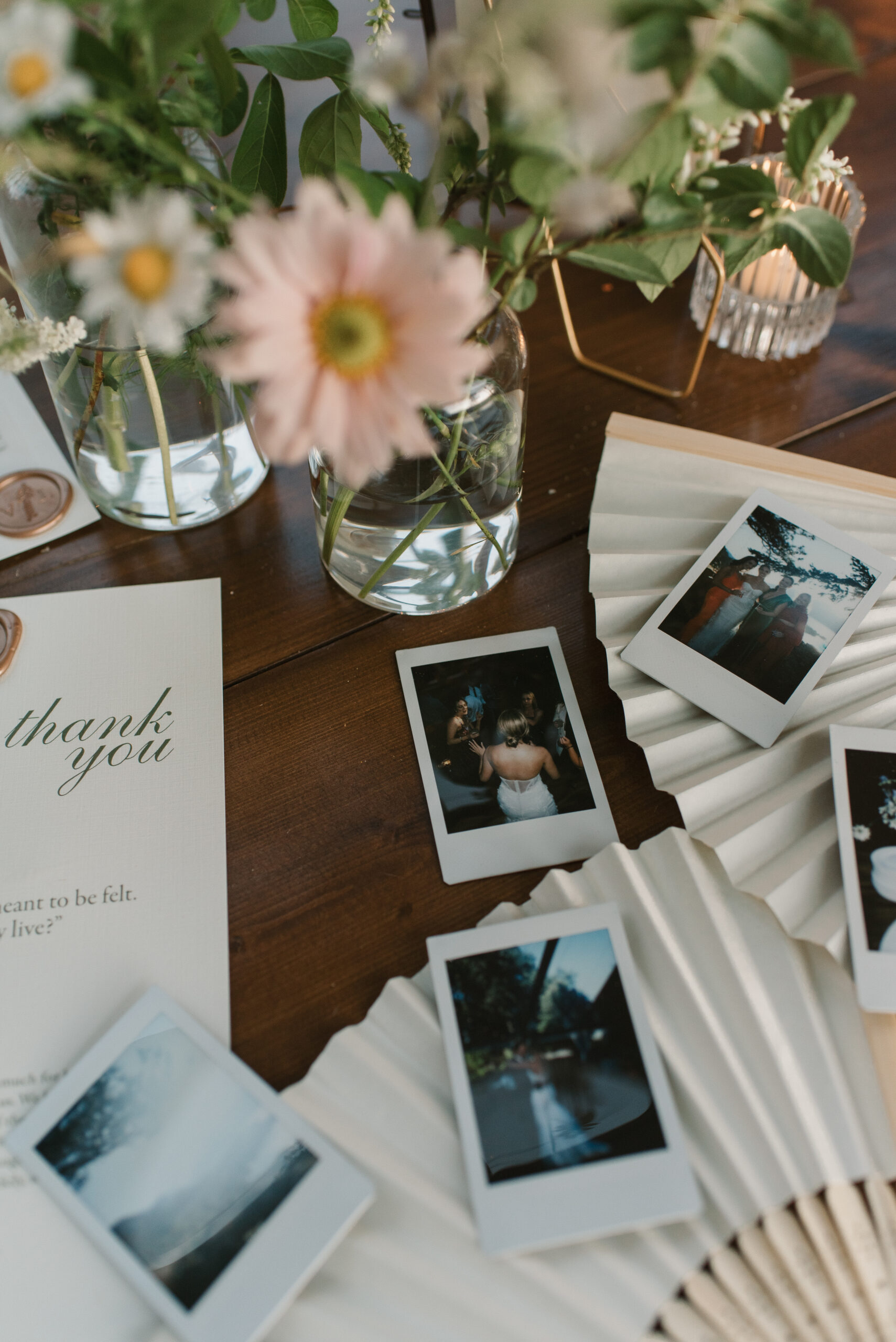 late night flat lay of polaroids during a wedding reception at the griffin house