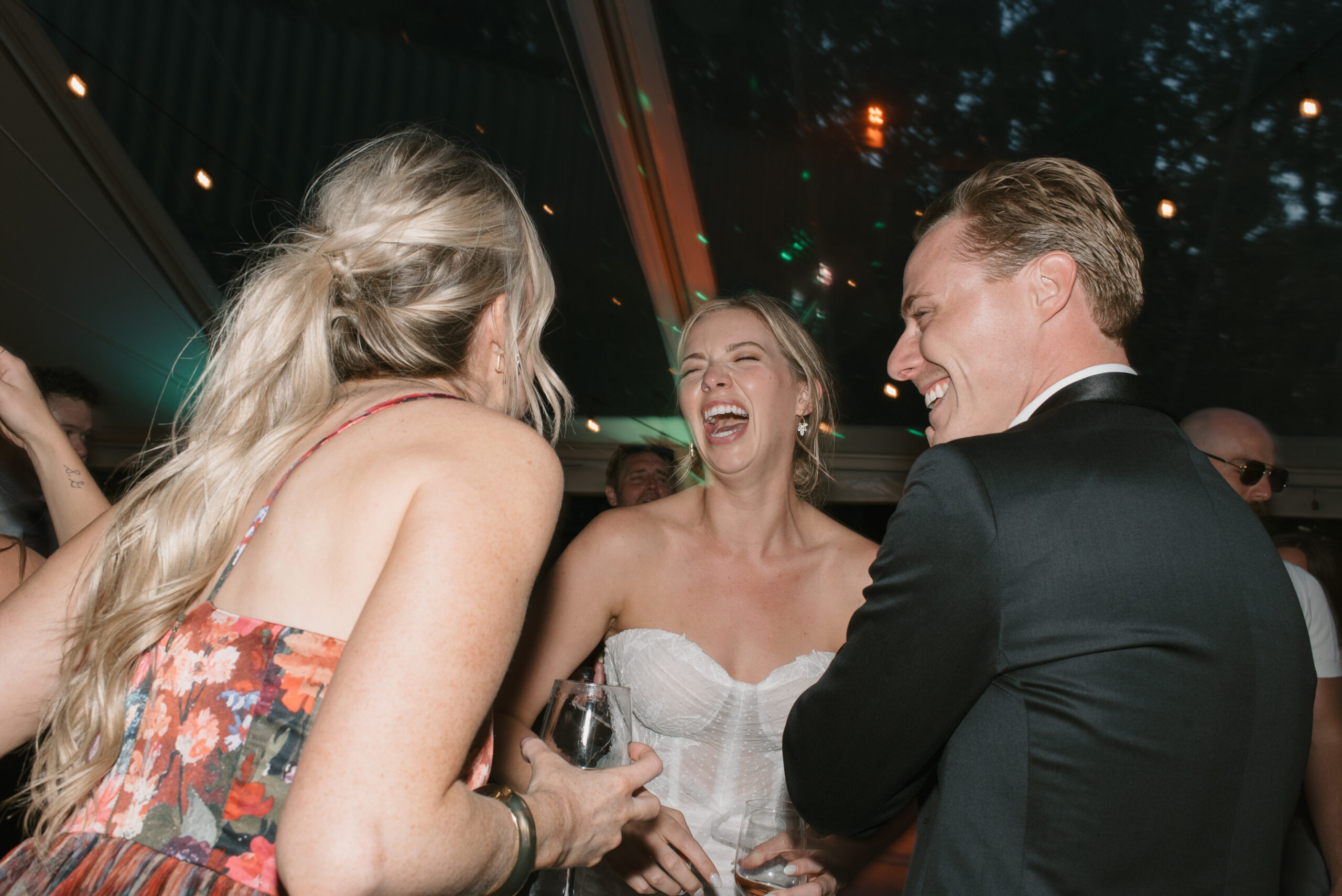 flash dance floor photo of bride and groom having the time of their lives