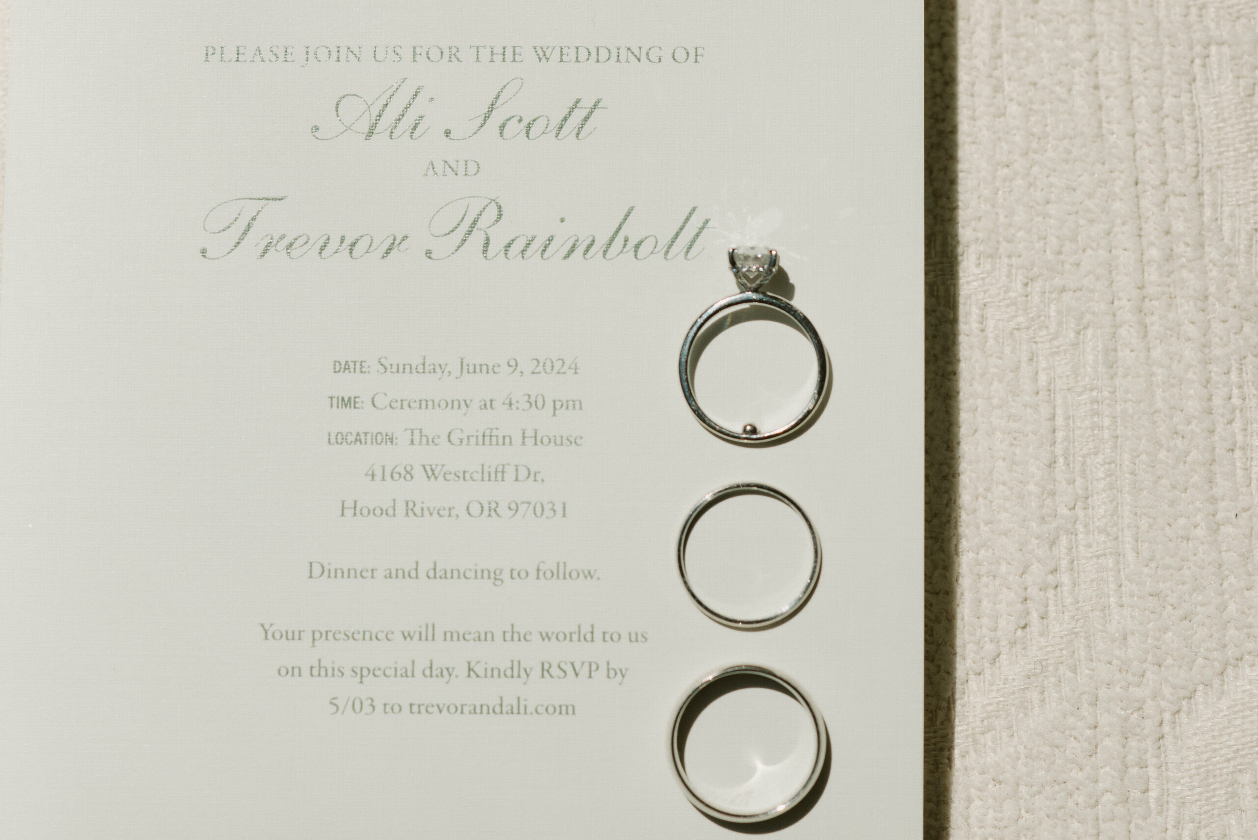 Wedding invitation with the wedding bands on them