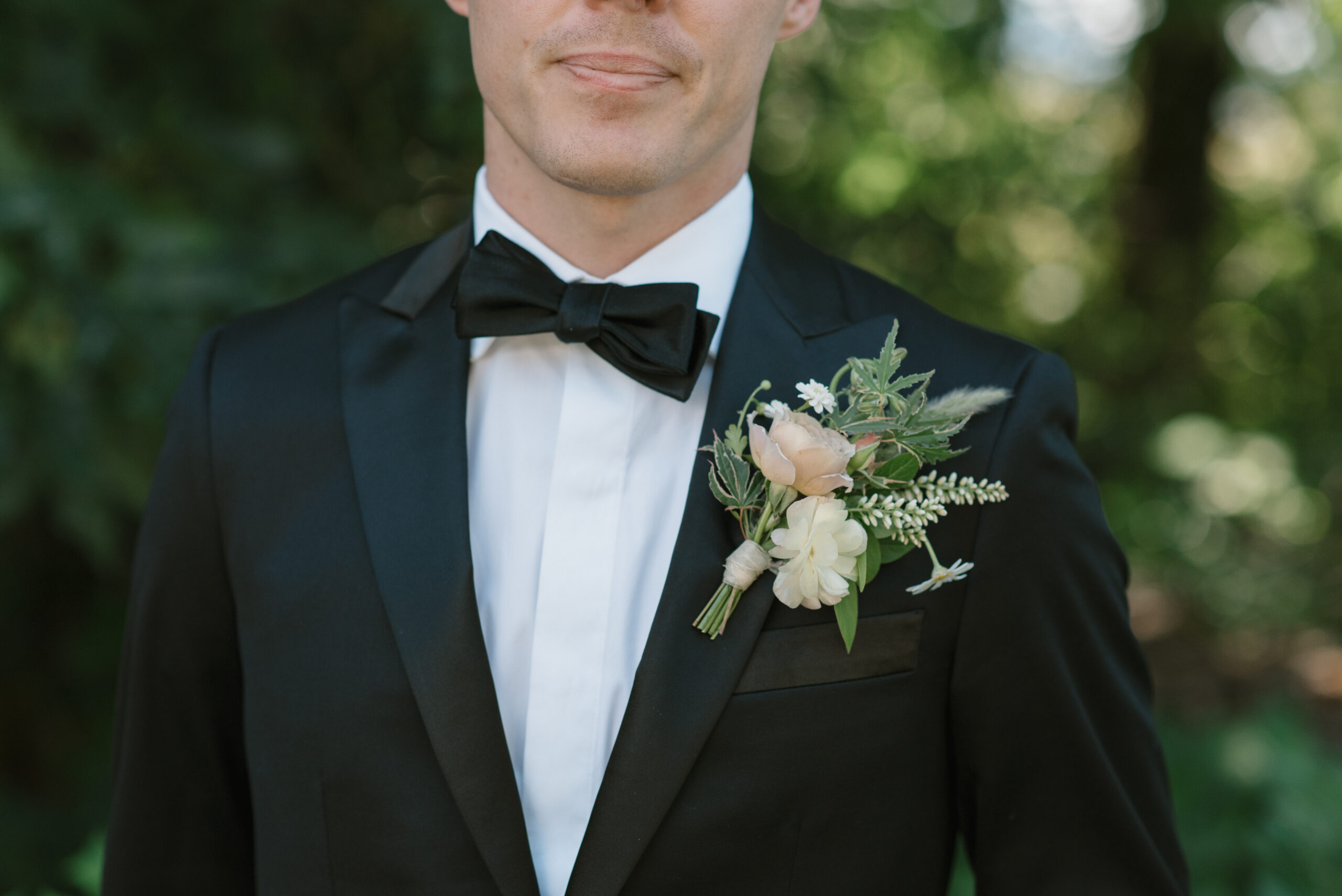 a closeup of the groom's boutonniere on his wedding day at The Griffin House 