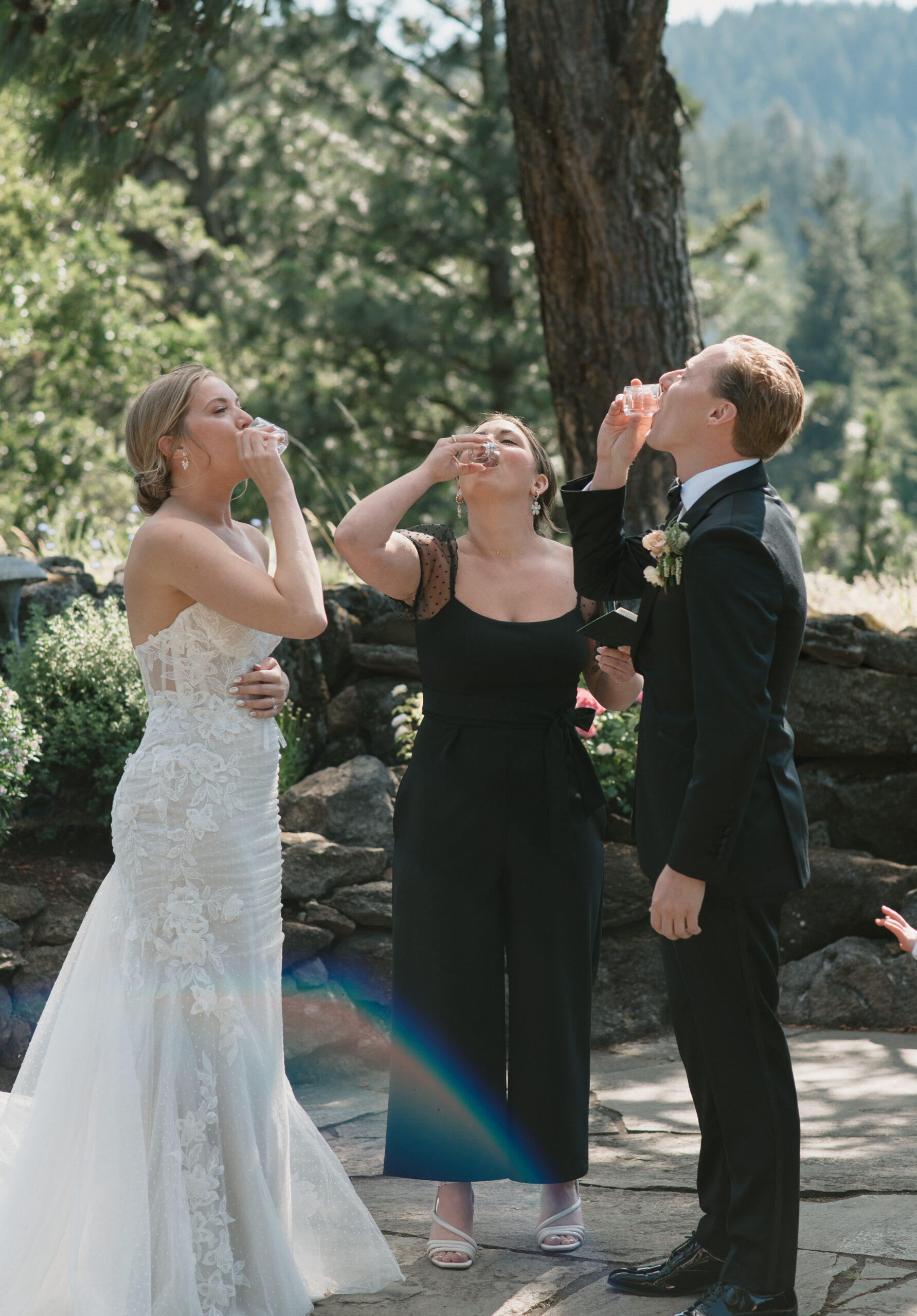 Bride and groom talking a tequila shot during their ceremony