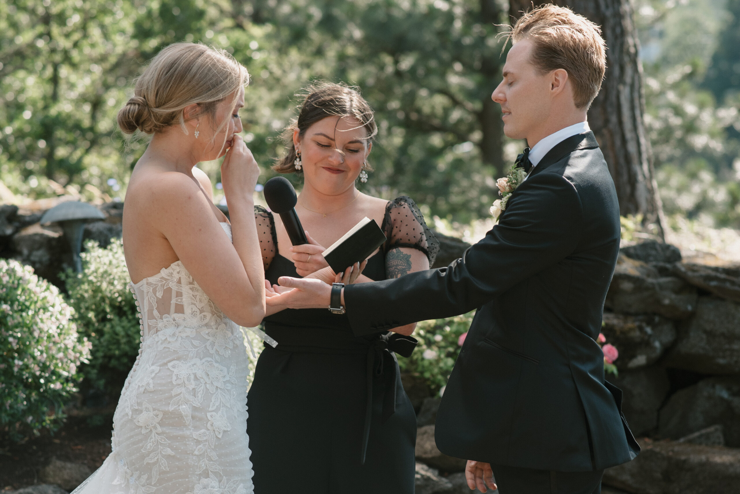 The groom comforting the bride during her vows