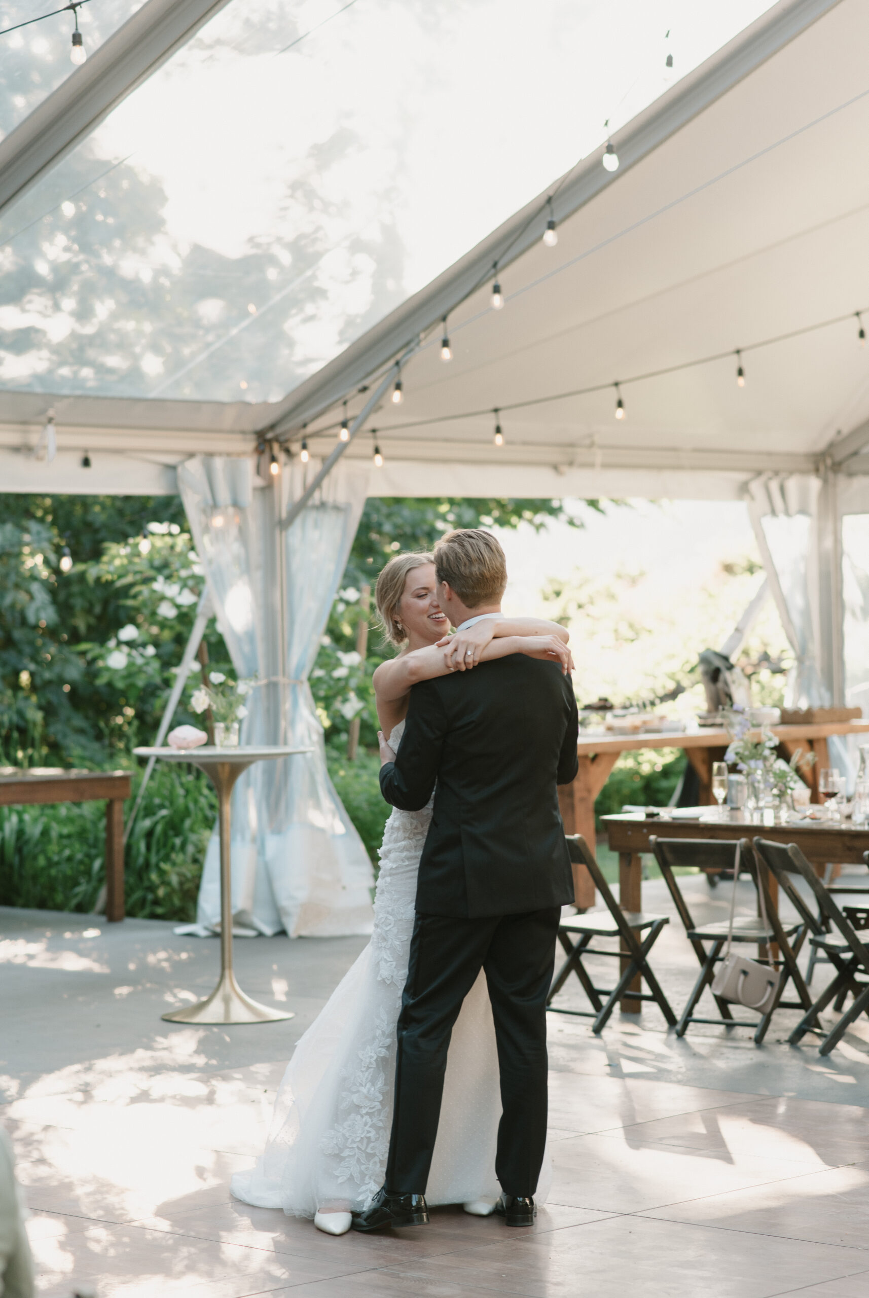 light and airy photo of the wedding couple's first dance