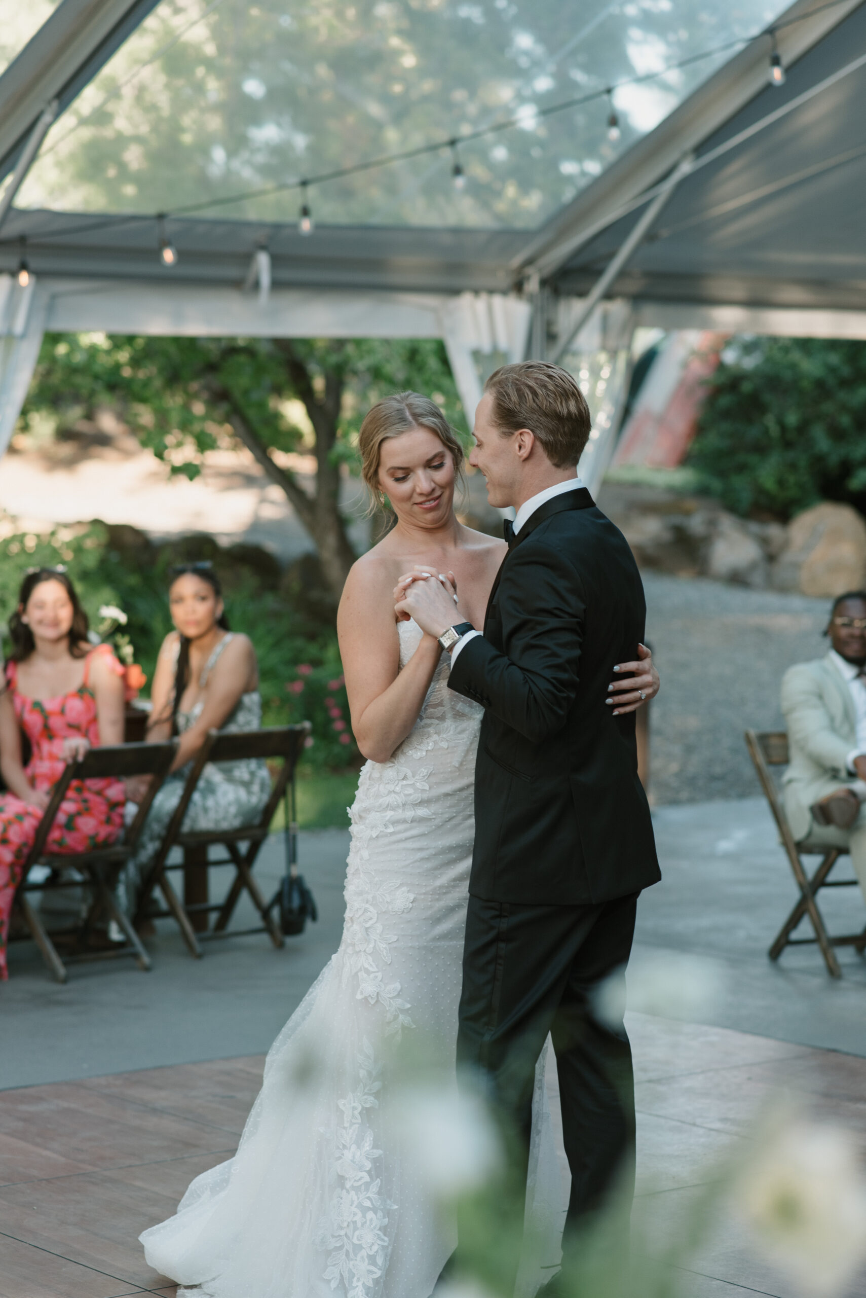 bride and groom sharing their first dance underneath the reception tent at the griffin house