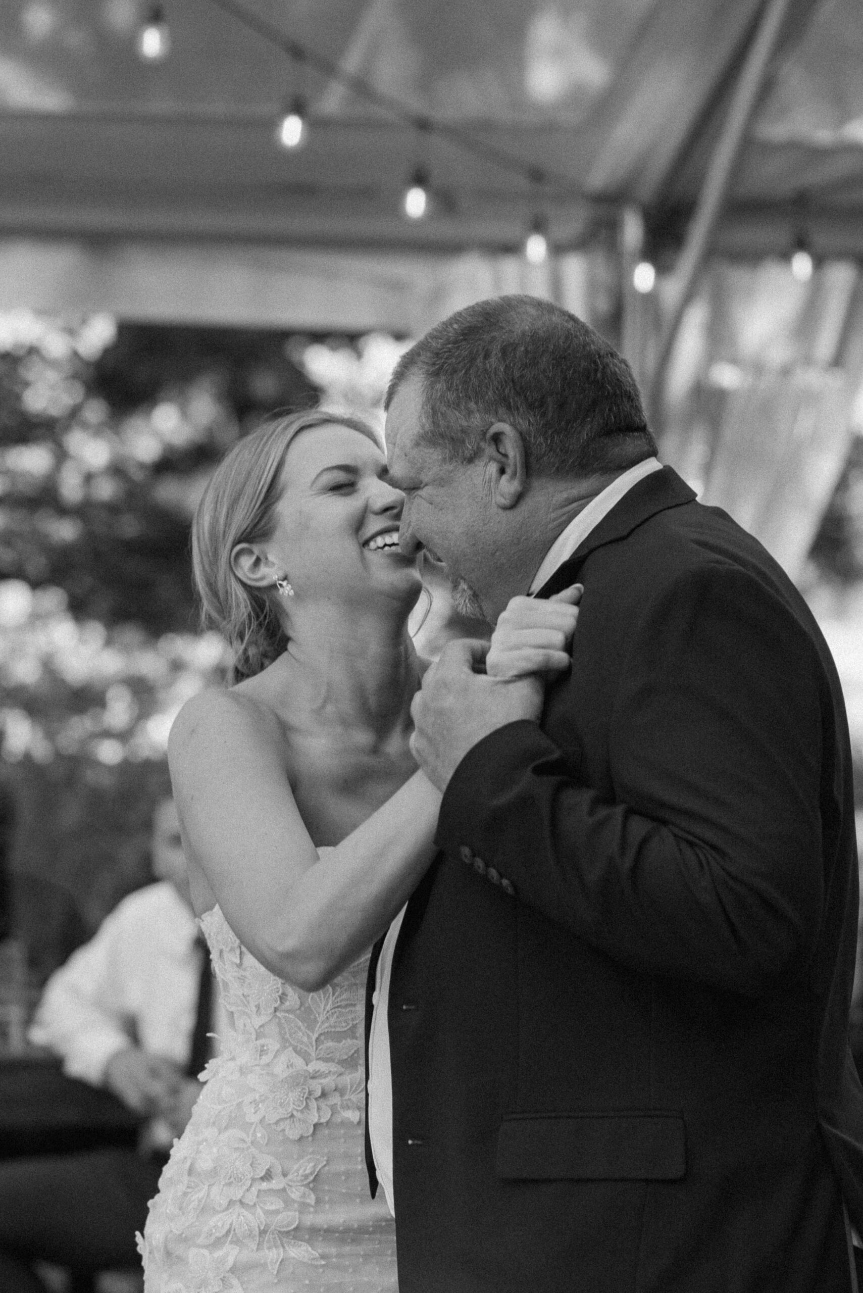 black and white of the bride dancing with her father