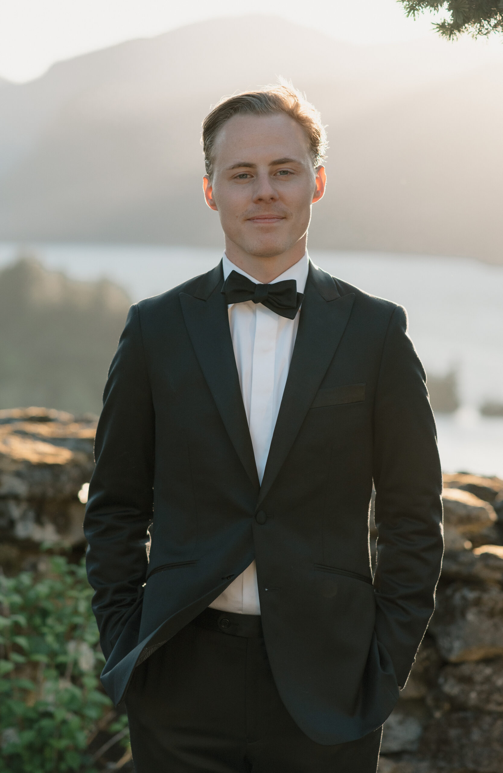 a portrait of the groom at sunset