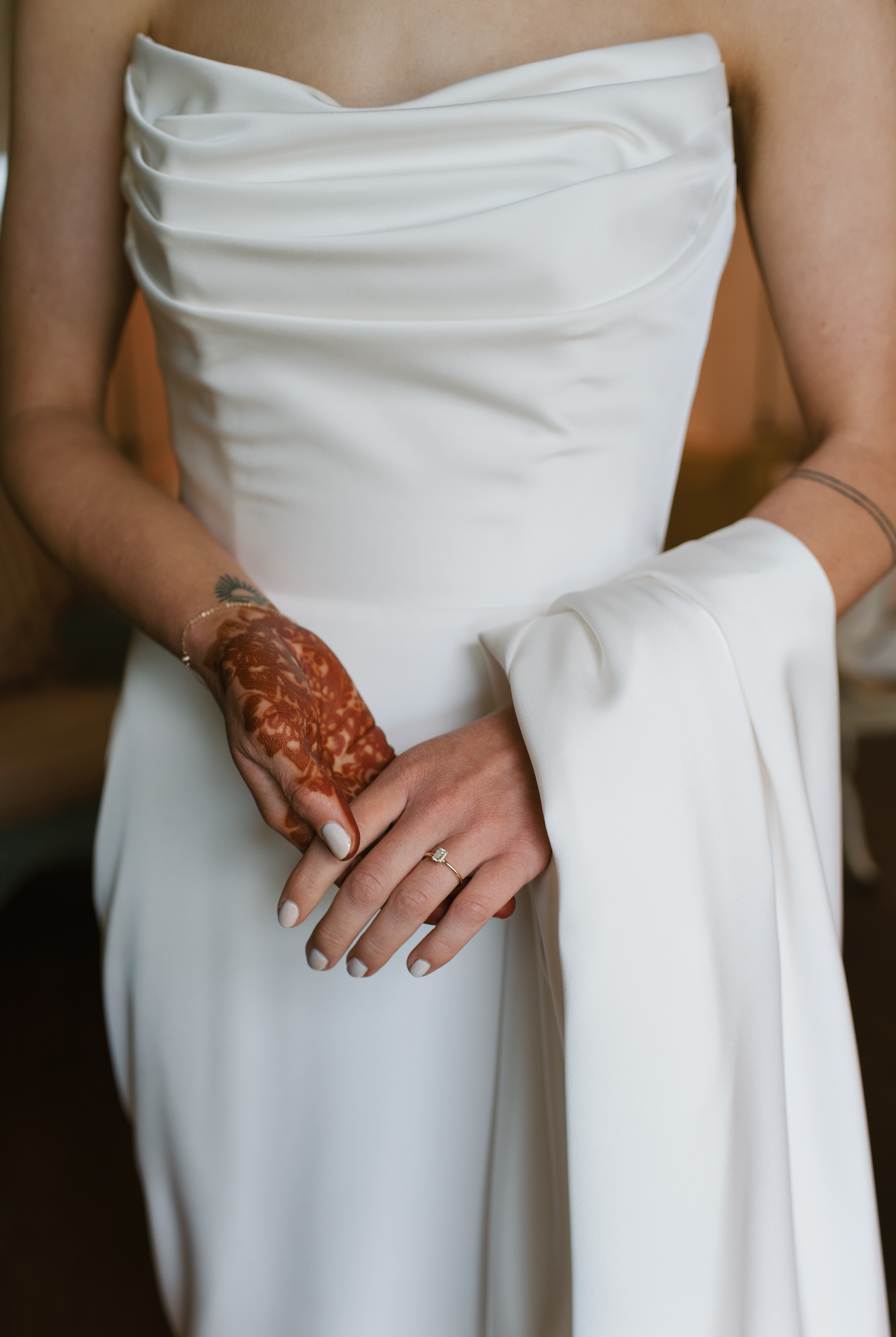 close up of Justin Alexander wedding gown on bride with traditional hand henna