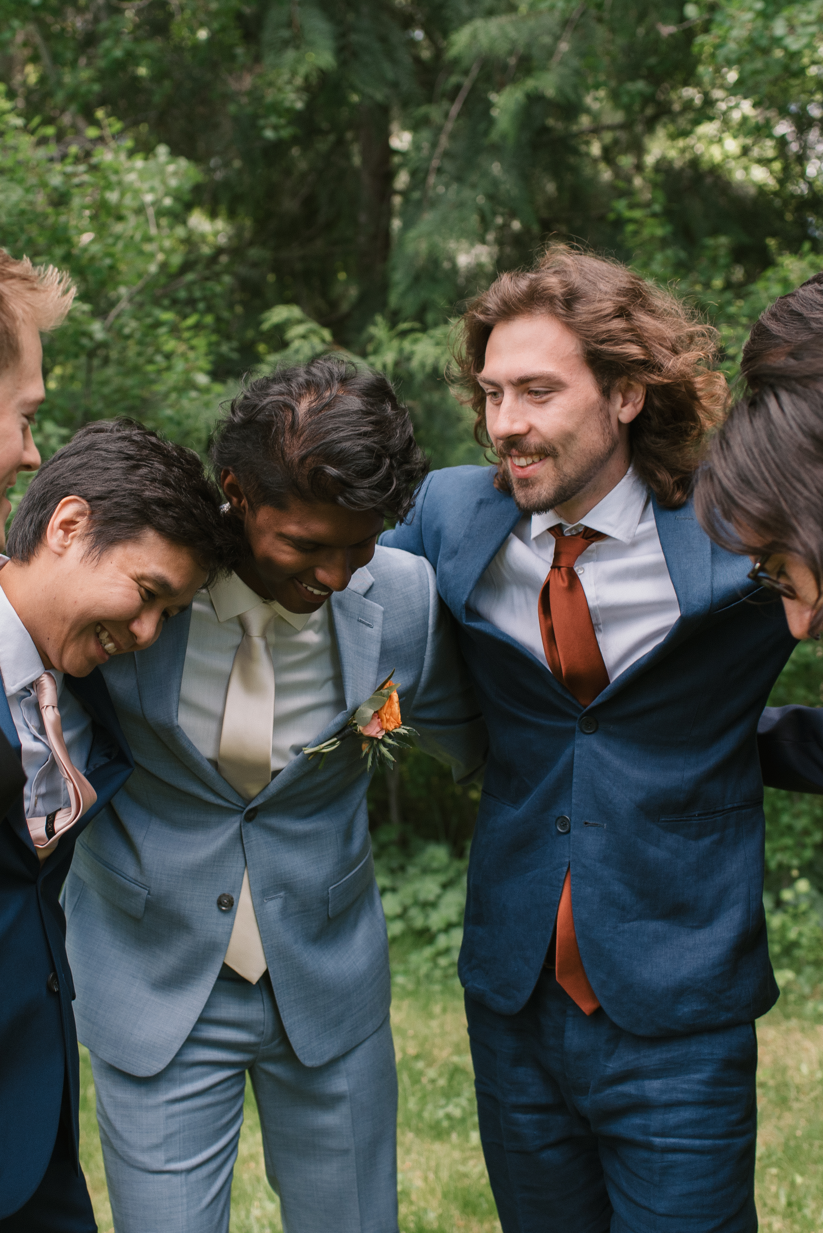 bro hugs of groom with his groomsmen at mt hood organic farms wedding