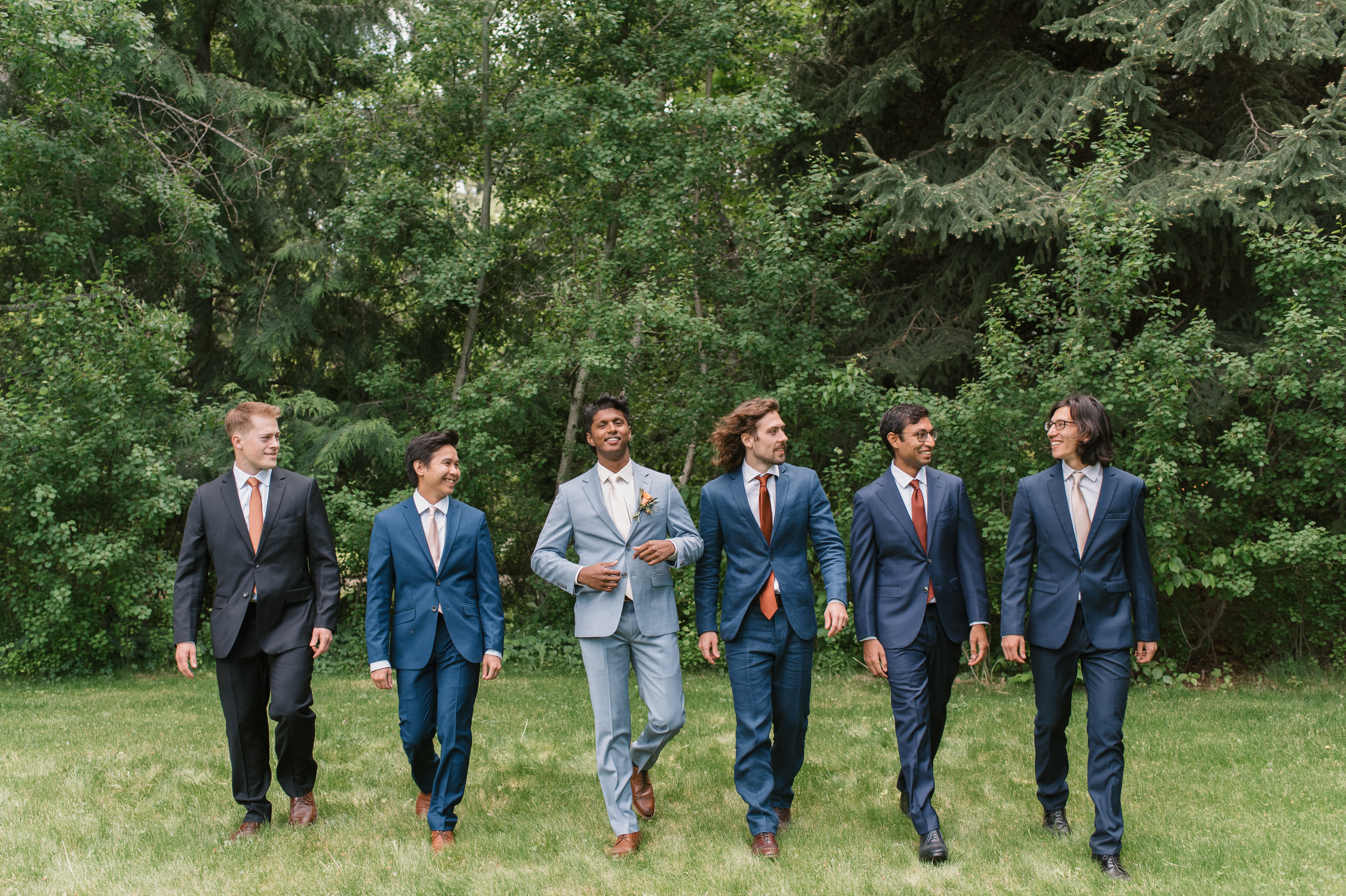 groom walking with his groomsmen