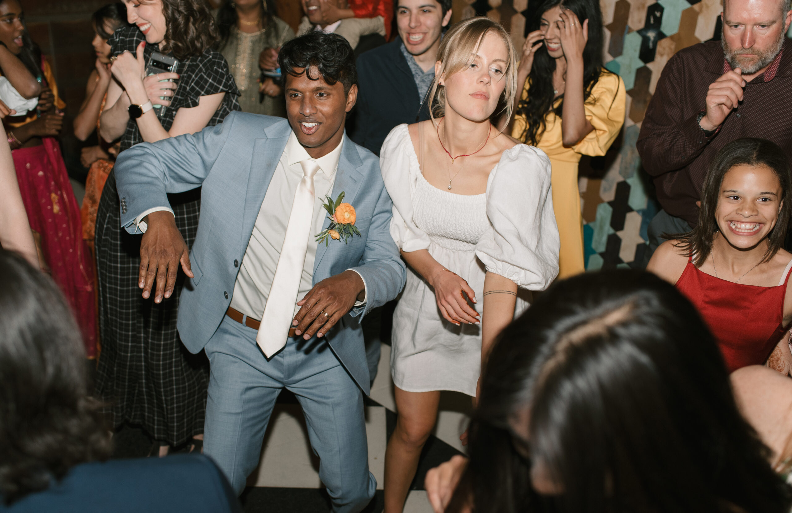 a flash photo of the couple dancing at their reception