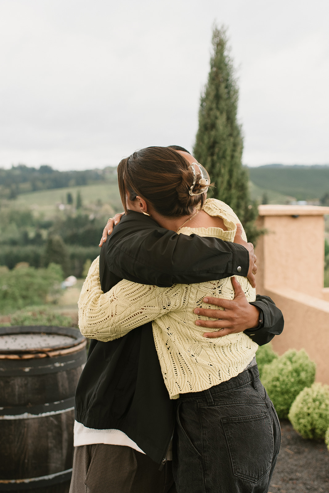 couple hugging after winery proposal