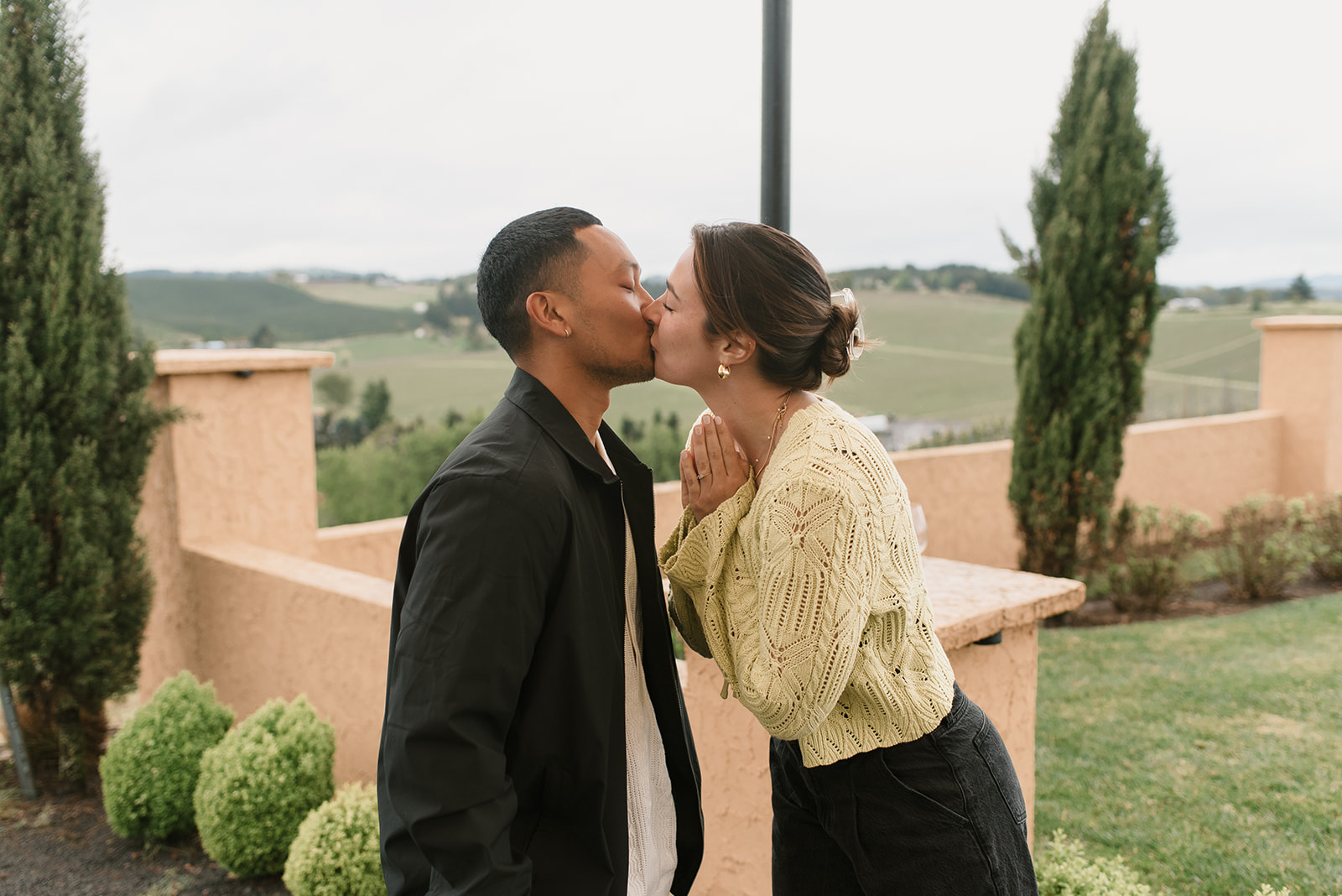 couple kissing after winery proposal