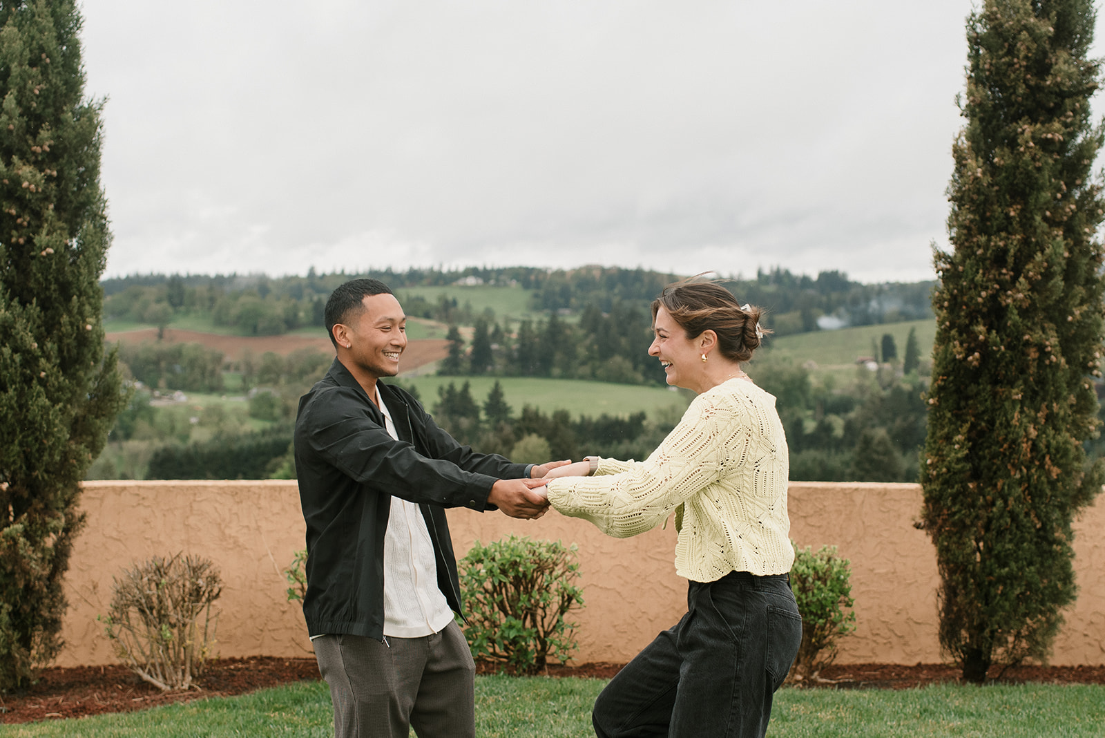 couple being playful at an oregon winery