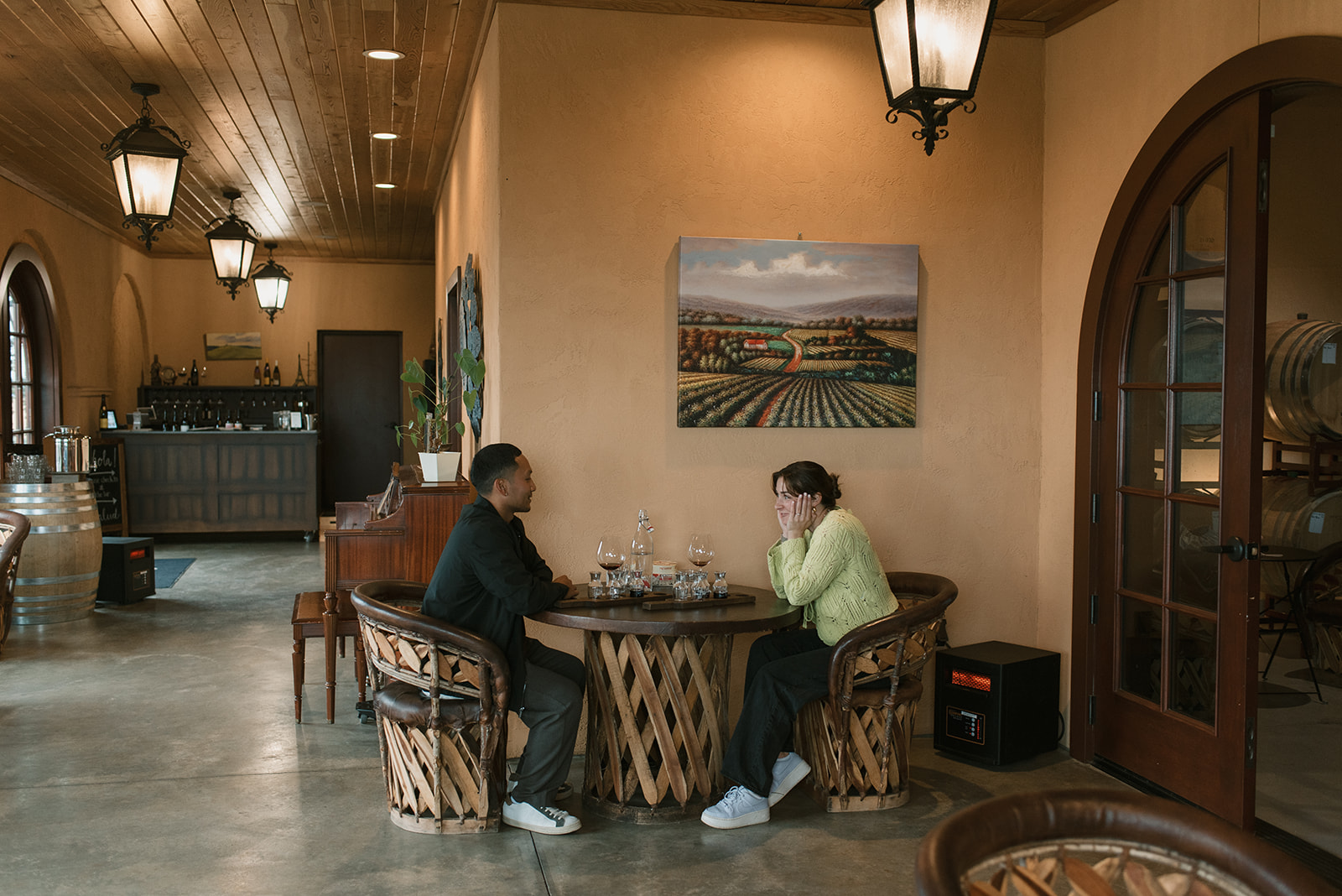 couple keeping warm inside an oregon winery